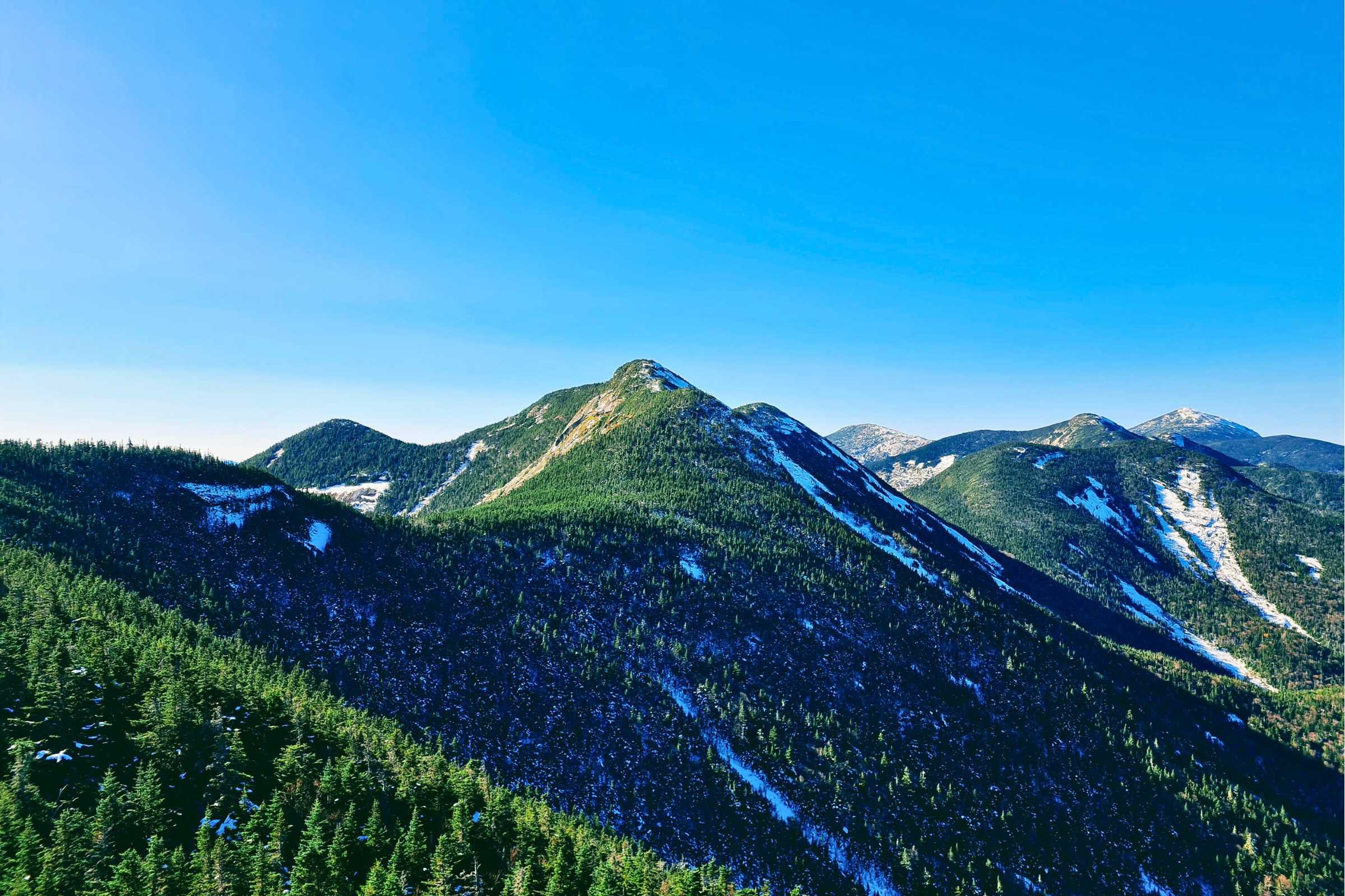 A view of Gothics, Saddleback, Basin, Haystack, with Marcy in the distance. Photo by Aubri Drake.