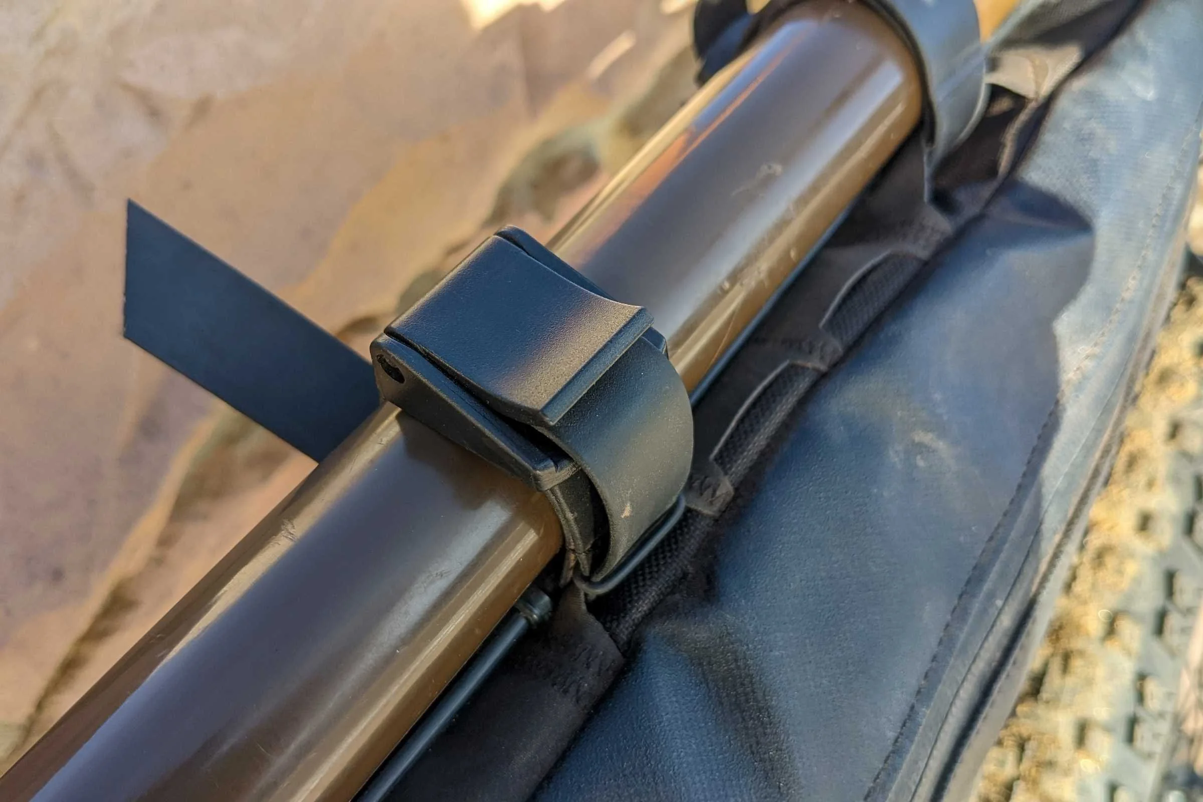 Camming buckles are a more secure way to attach frame bags to your bike, but they are also more difficult to attach. Here, we’re looking at the camming buckles on the Bontrager Adventure Boss.