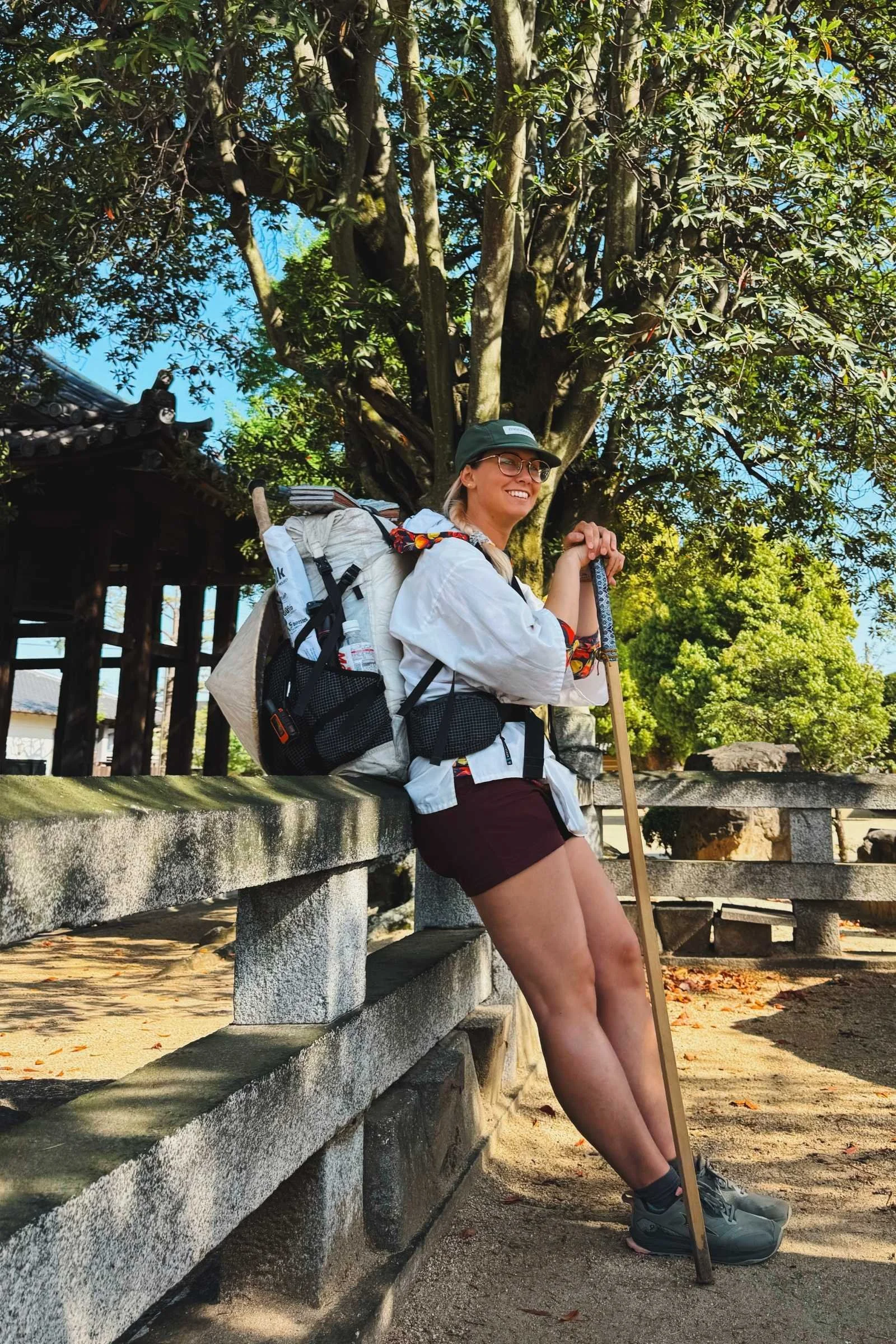 A woman rests at a temple