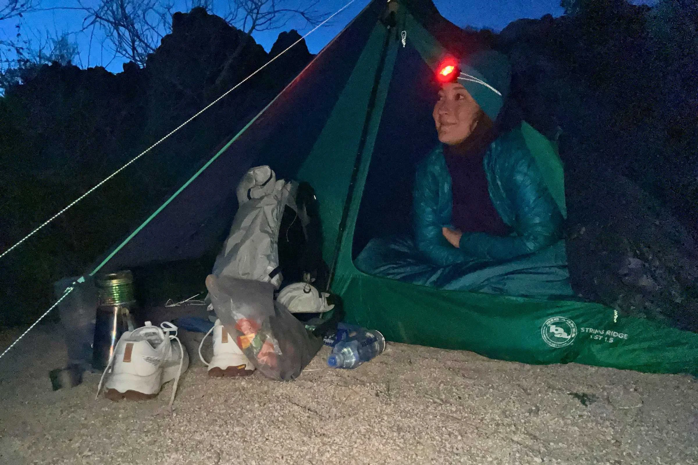 Close-up on everything that can fit in the vestibule of the Big Agnes Ridge VST including my pack, foodbag, shoes, stove, and water bottles taken on a backpacking trip in Joshua Tree.