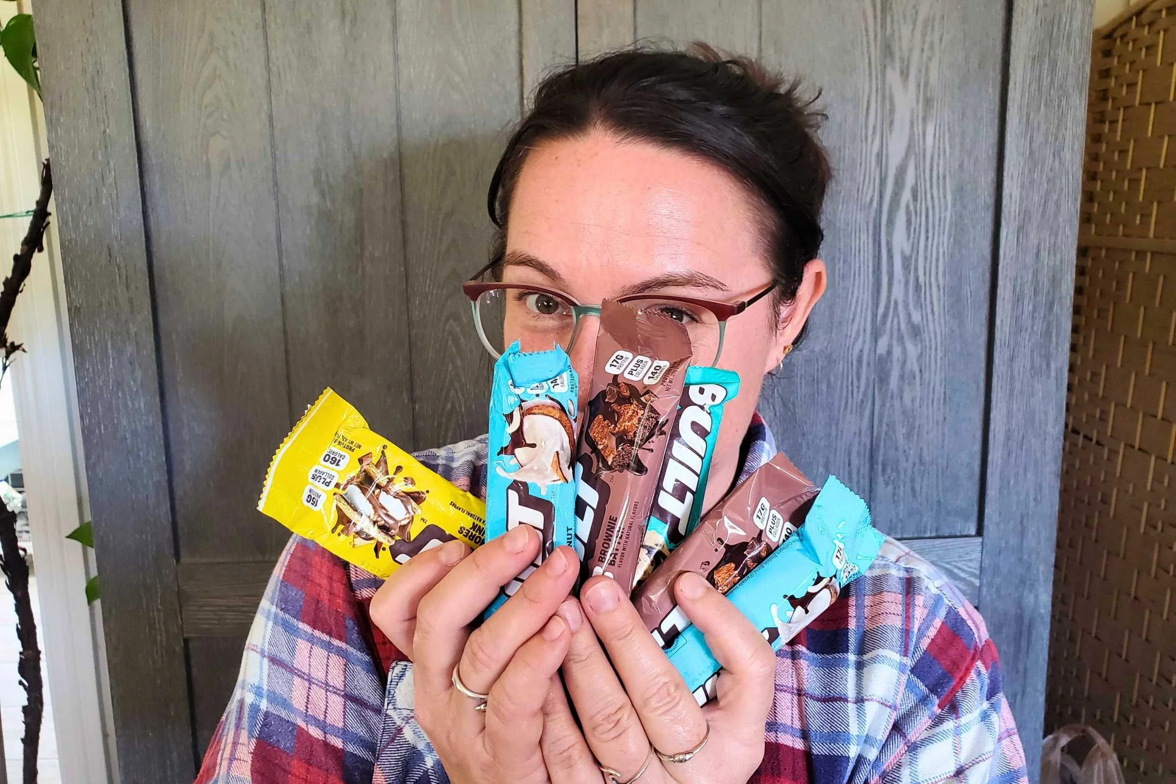 person holding up BUILT Puff bars in front of their face