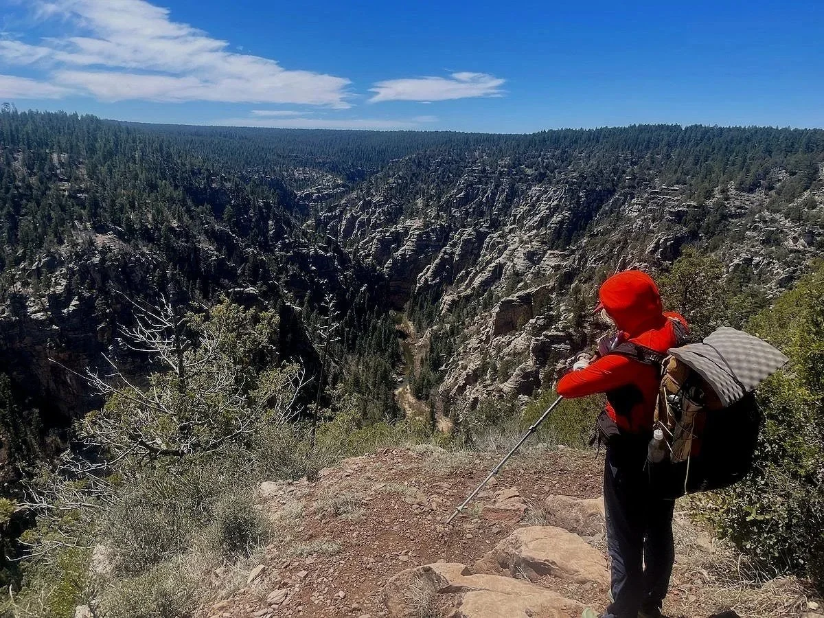 Naomi Hudetz testing the Garmin epix Pro (Gen 2) overlooking a canyon on the Mogollon Rim Trail