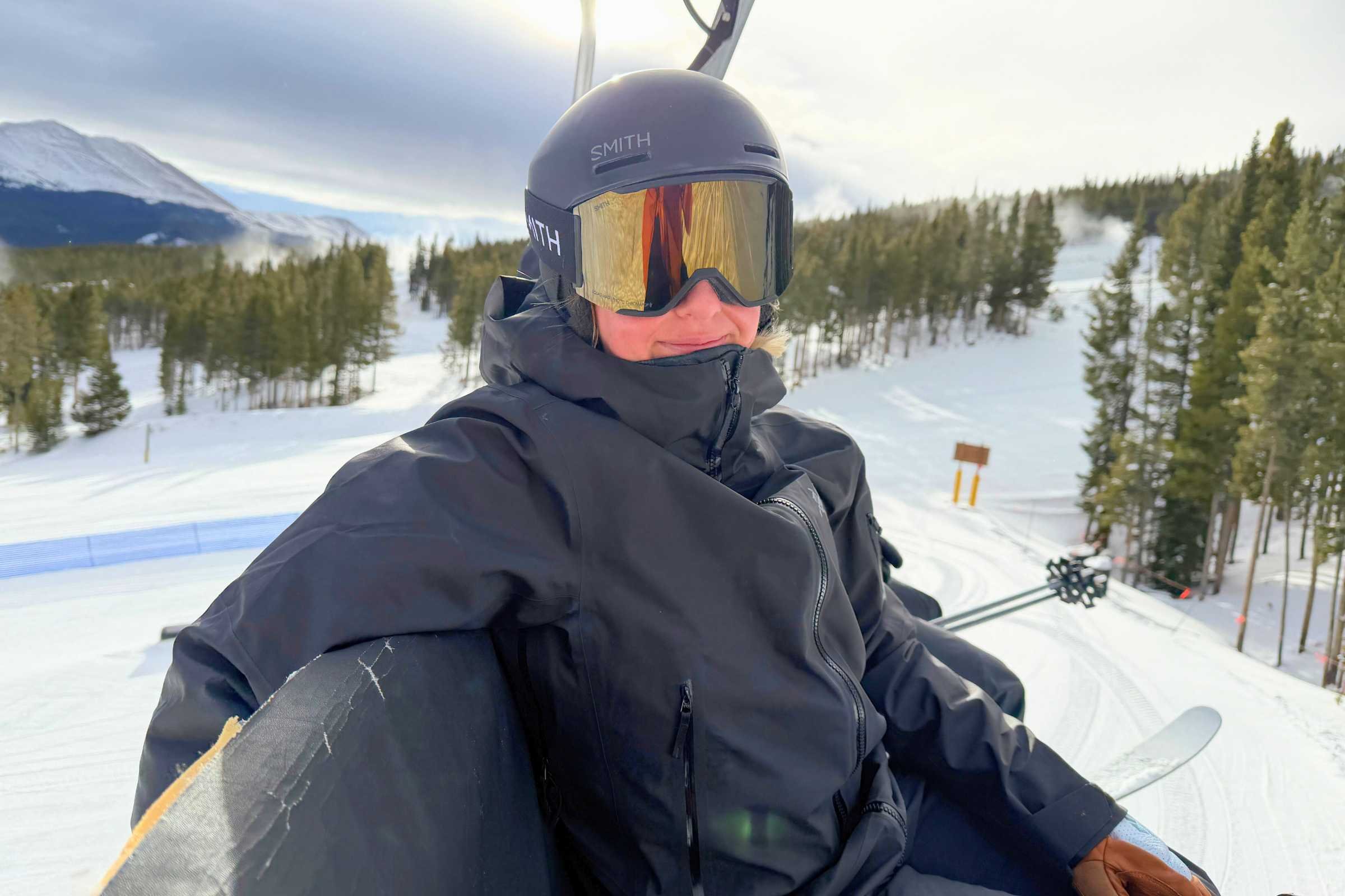 Skier on a lift wearing the Arc'teryx Sentinel Ski Jacket