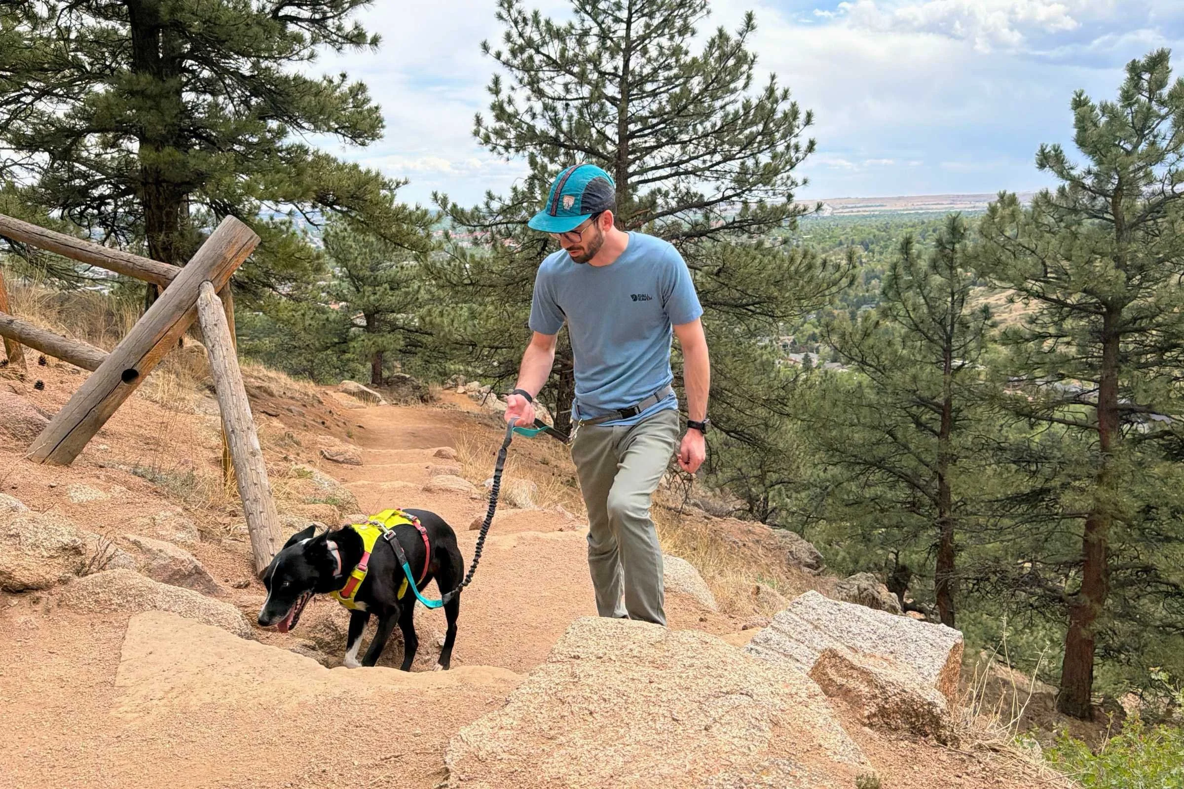 Dog and man walking on a dirt trail using a Tuff Mutt Hands-free Bungee leash