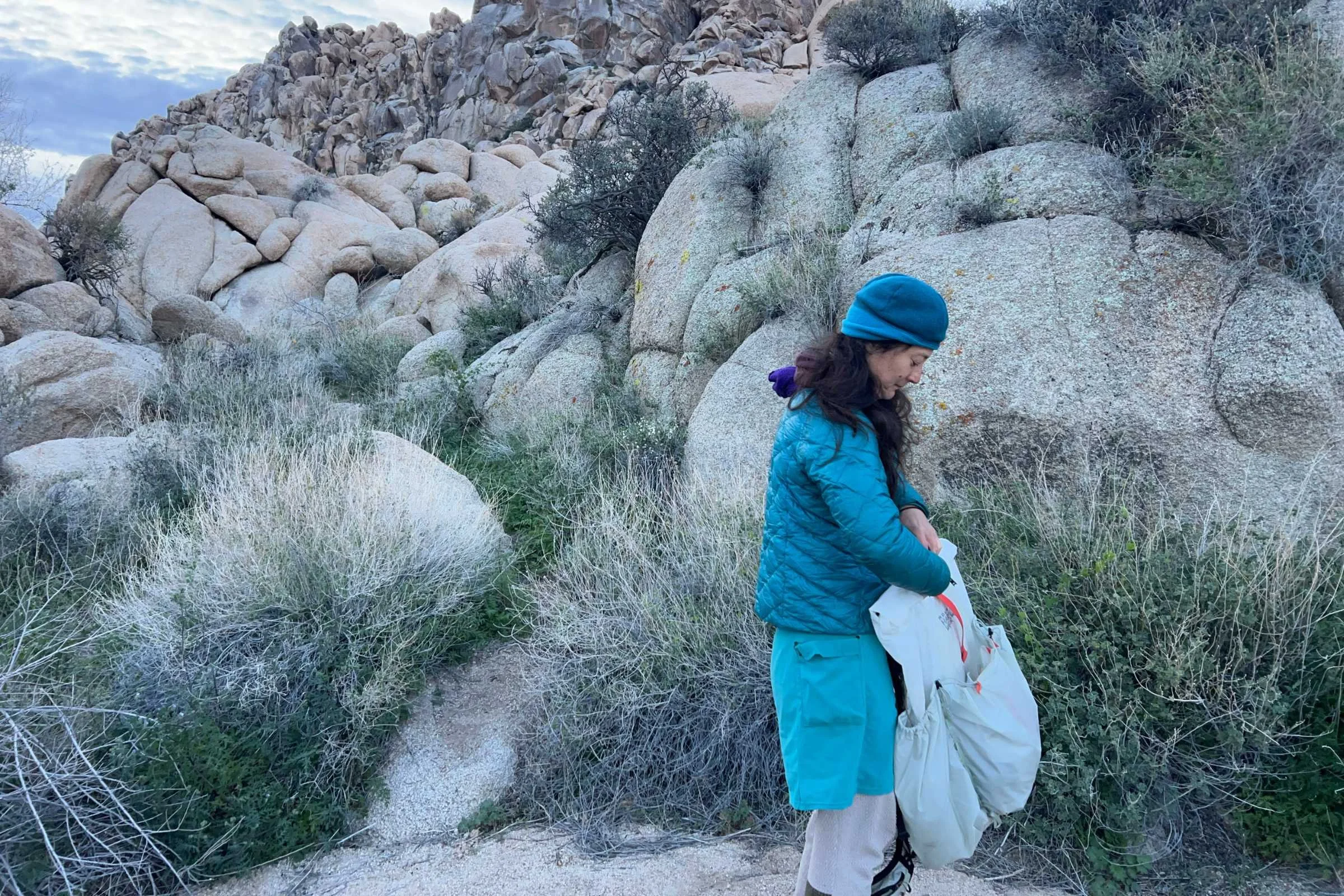 the author backpacking with the mountain hardwear alakazam pack with rock features in the background