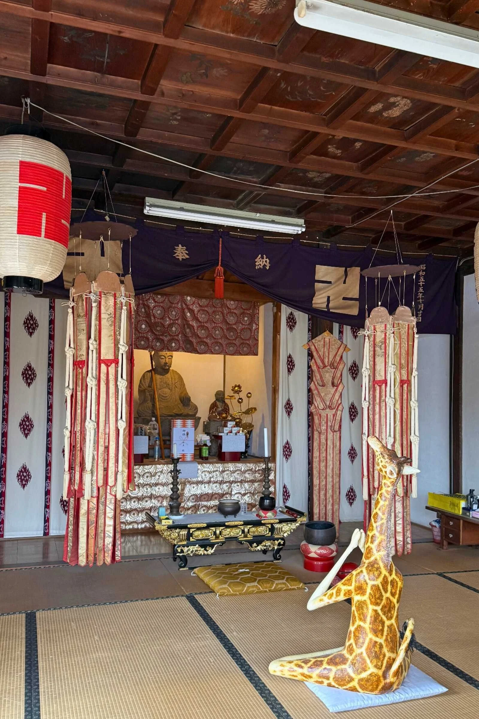 Giraffe statue inside a Japanese temple
