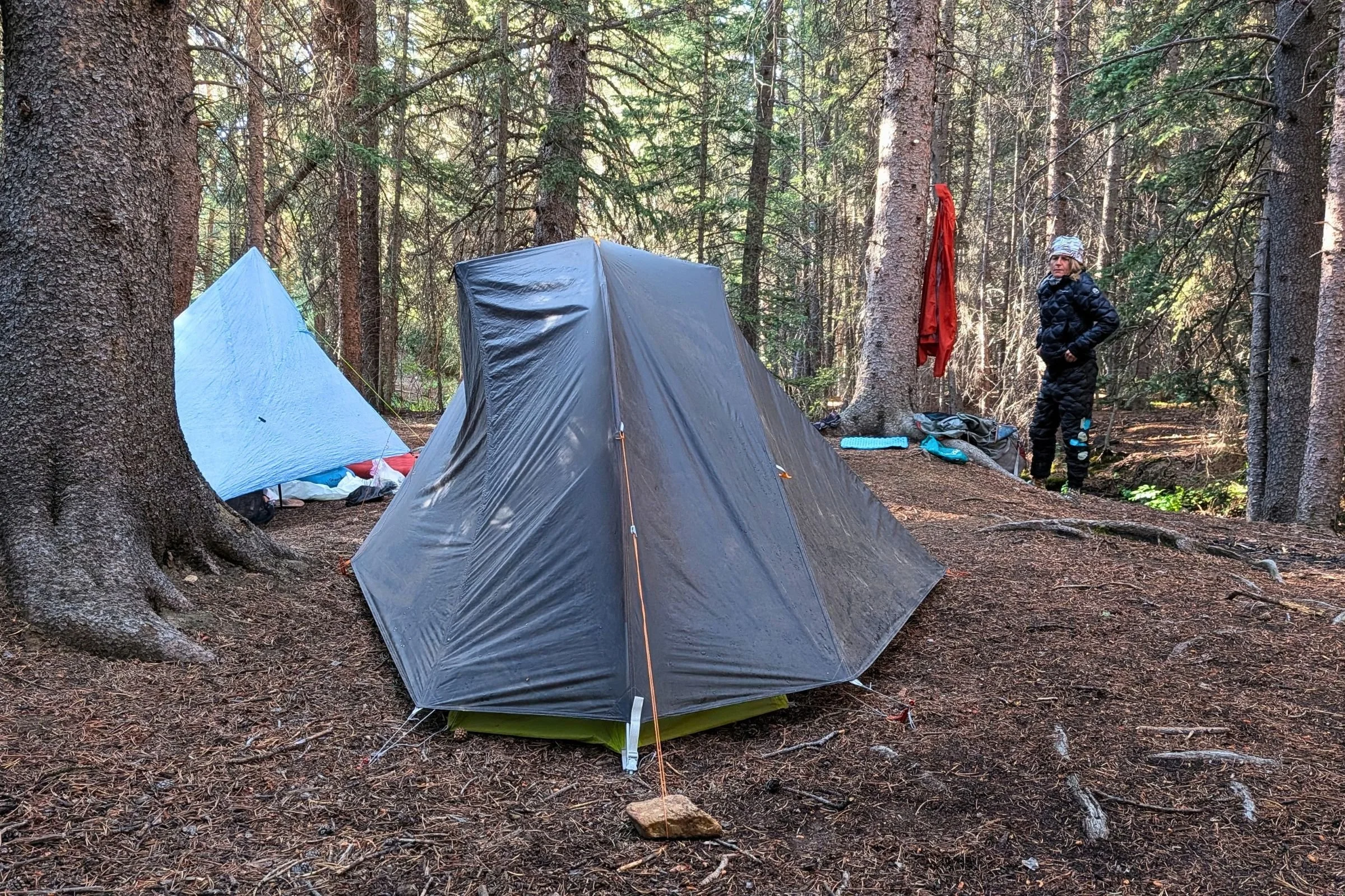 A head-on view of the Big Agnes Tiger Wall UL1 Bikepack Tent with a person standing in the background.