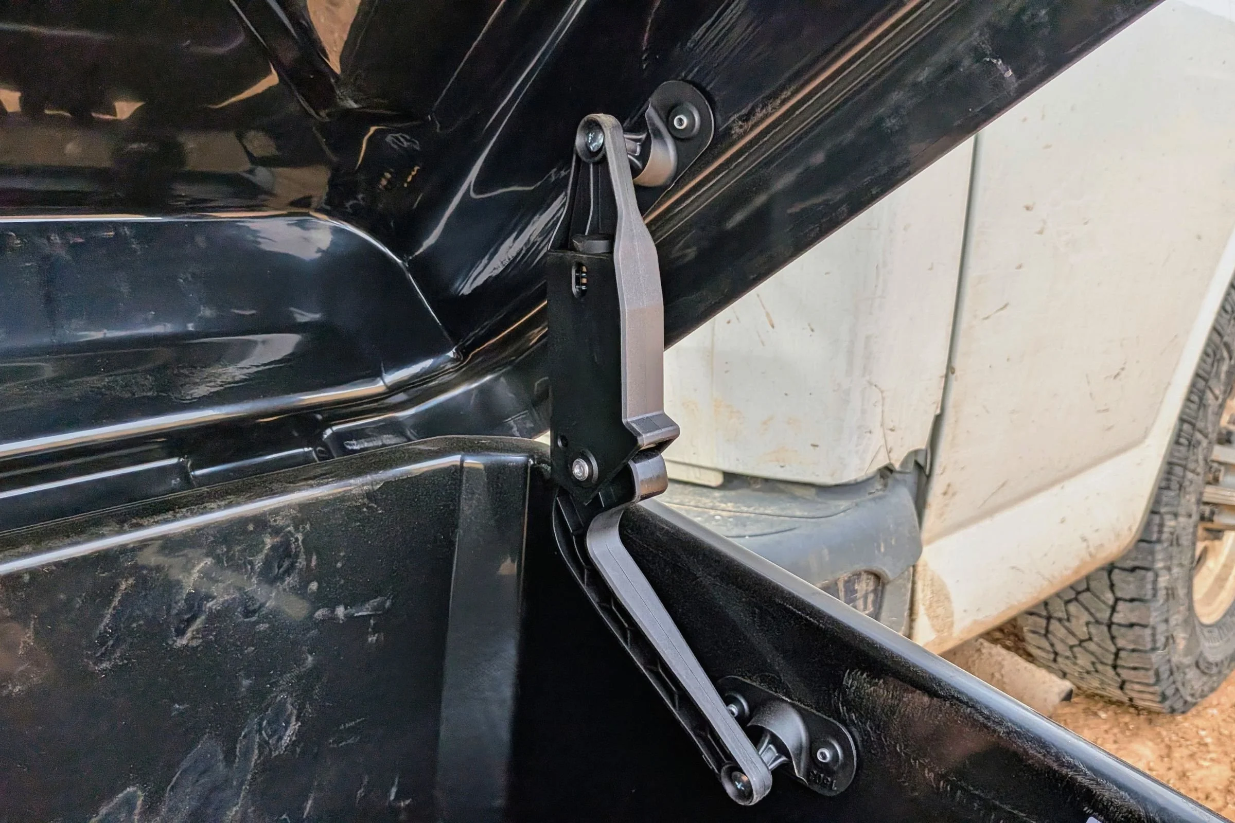 Close-up of a Yakima EXO GearLocker lid support strut holding the lid open.