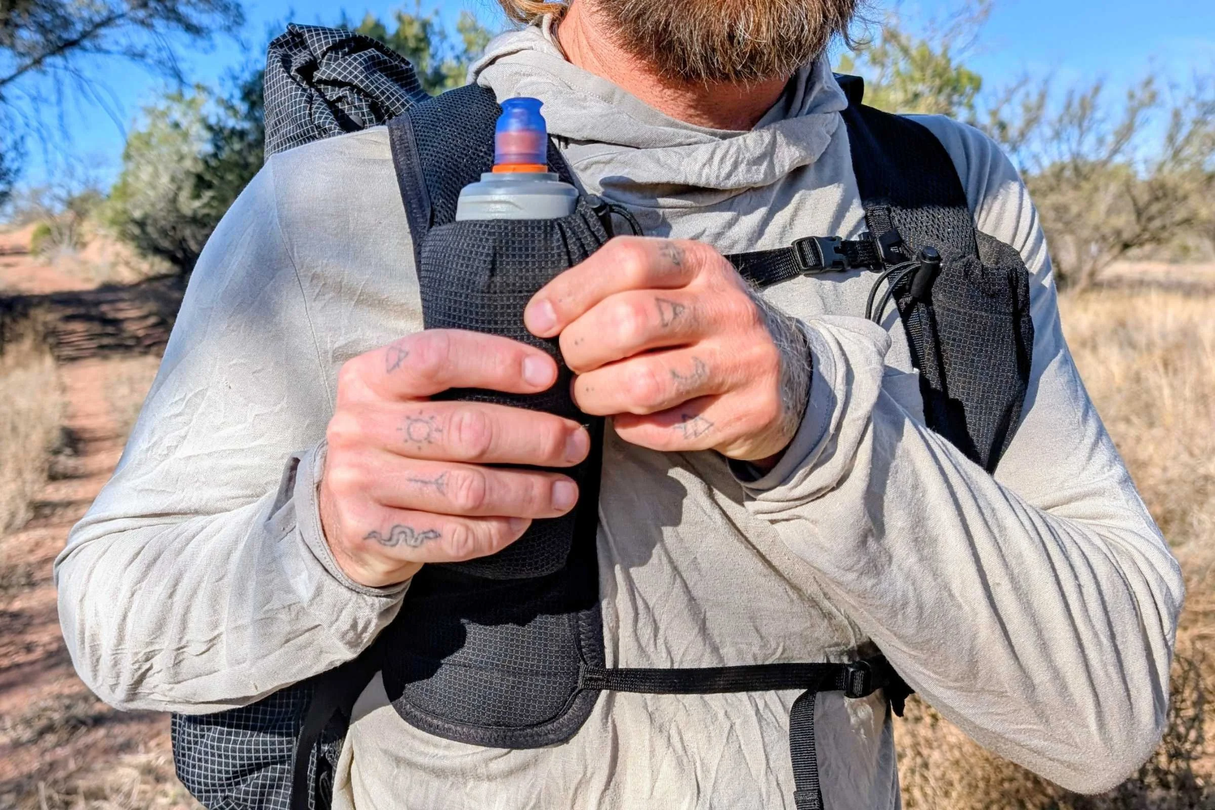 Each shoulder strap can hold a 500 mL soft flask water bottle.