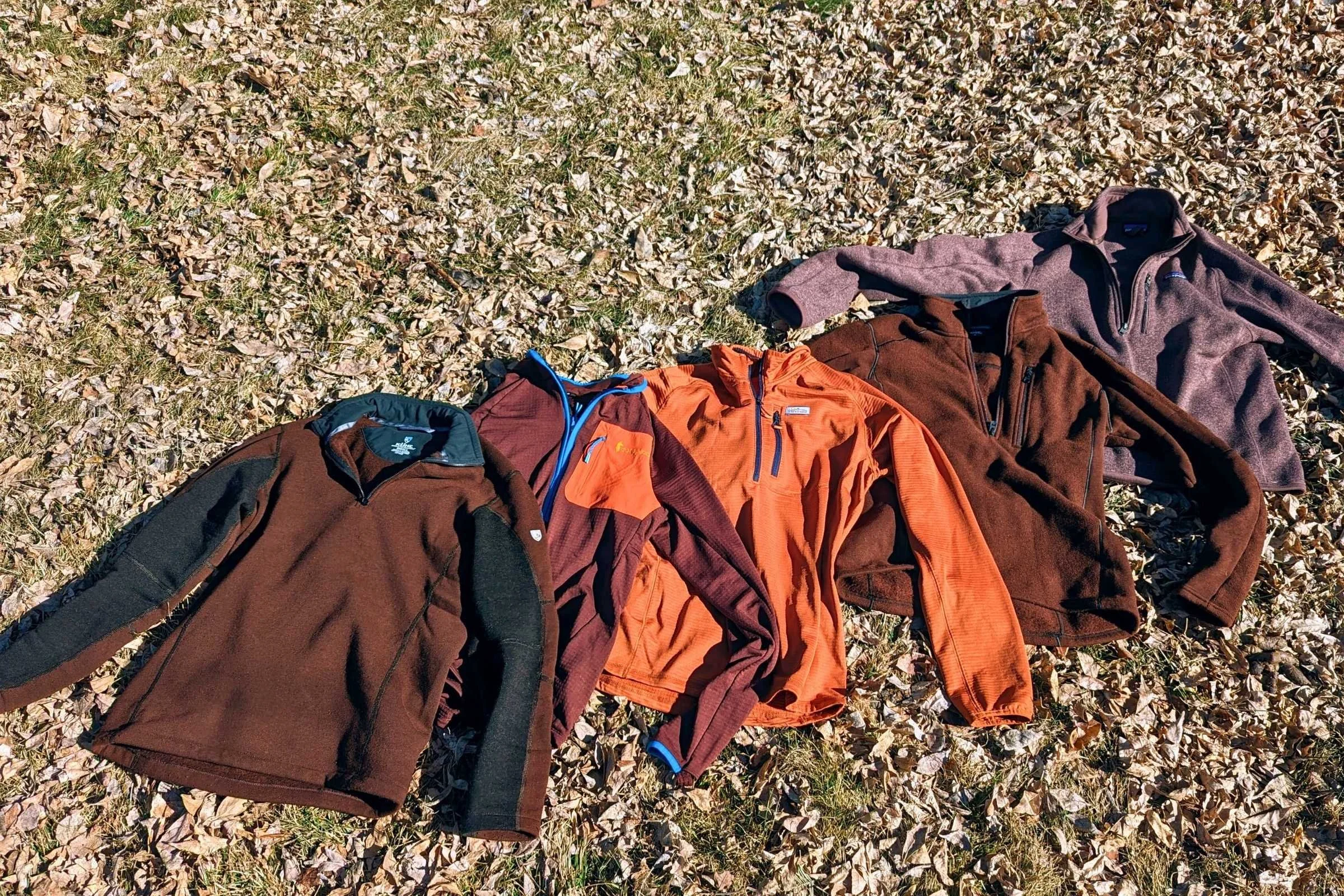 Some of the fleece jackets we tested side-by-side for the “Best Casual Fleece” category. From left to right: Kuhl Interceptor, Cotopaxi Otero, Orvis Horshoe Hills, Kuhl Revel, and Patagonia Better Sweater