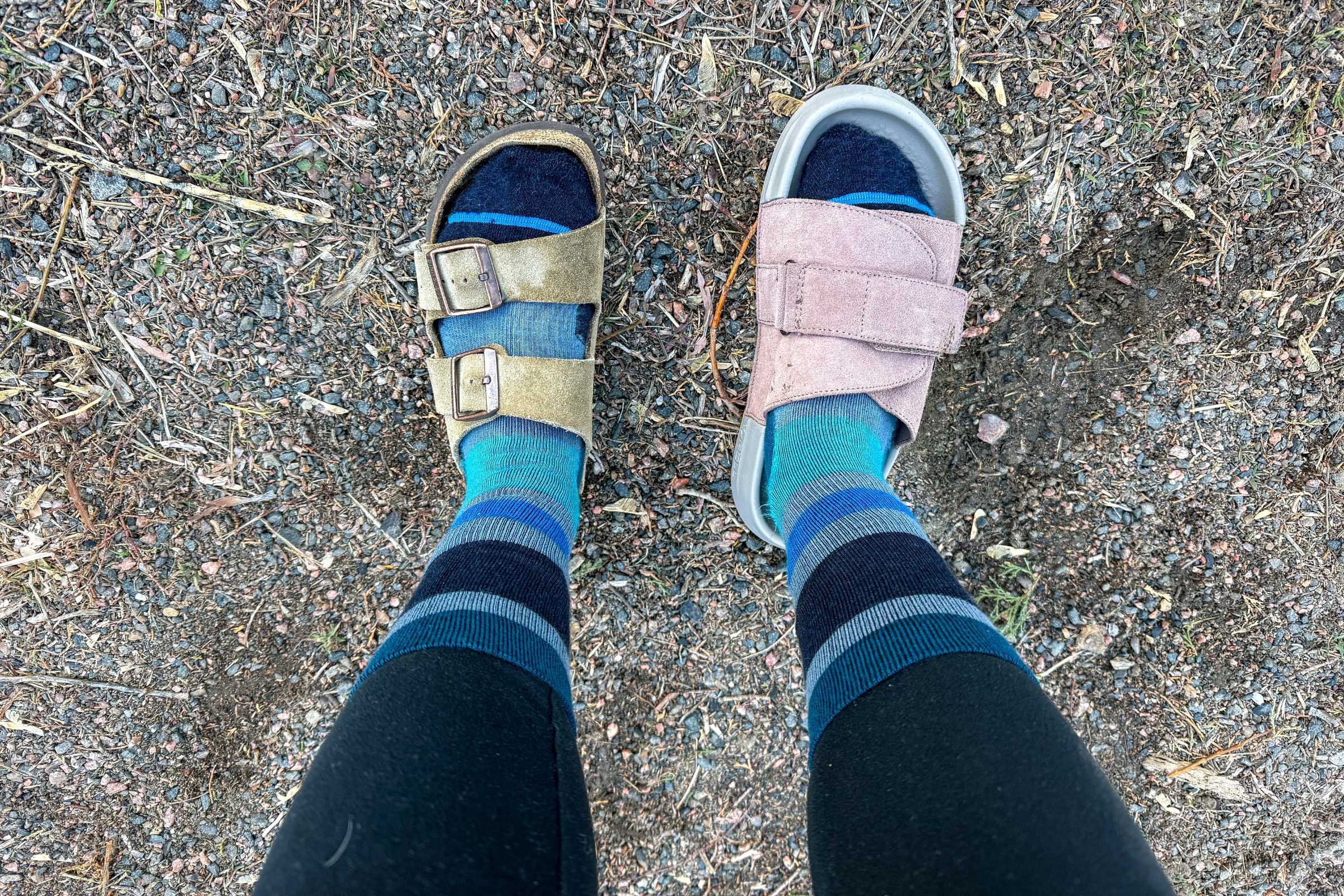 arizona soft footbed sandal on left foot and roll recovery superplush solace slides on right foot