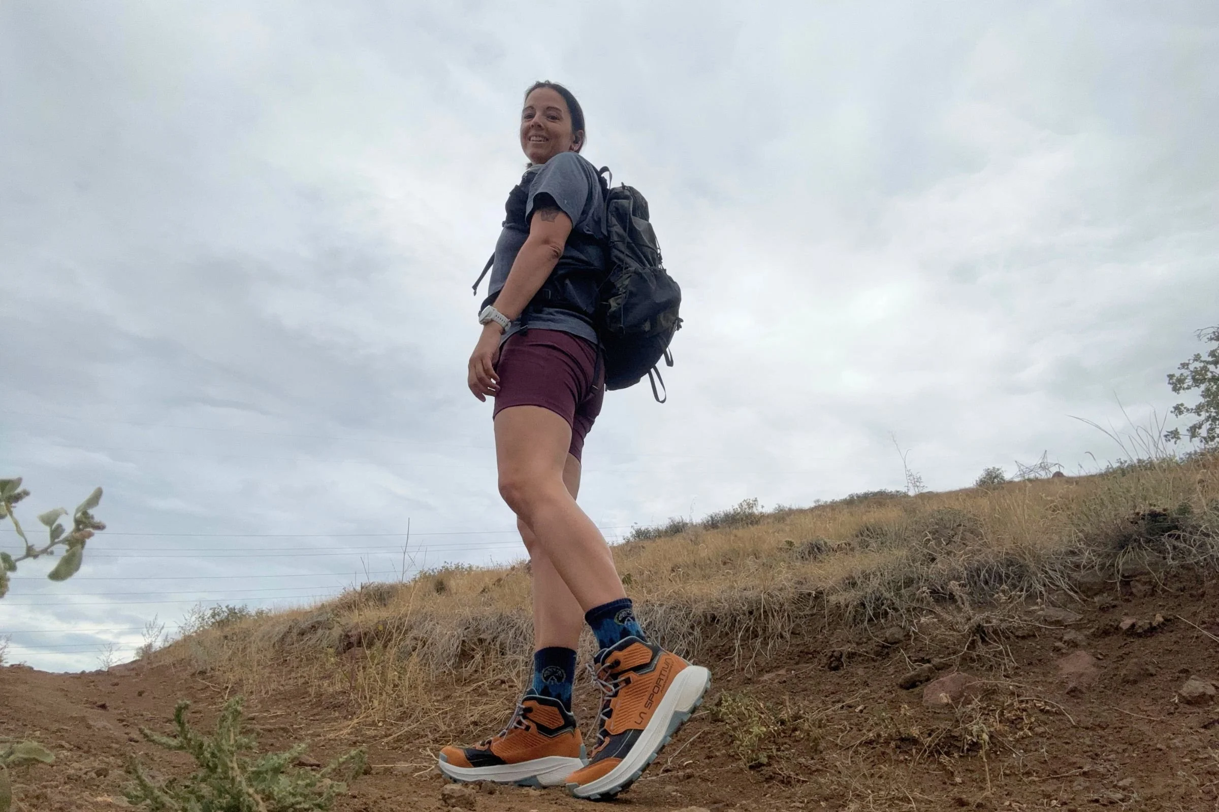 Woman wearing La Sportiva Prodigio Hike LT GTX hiking boots outside.
