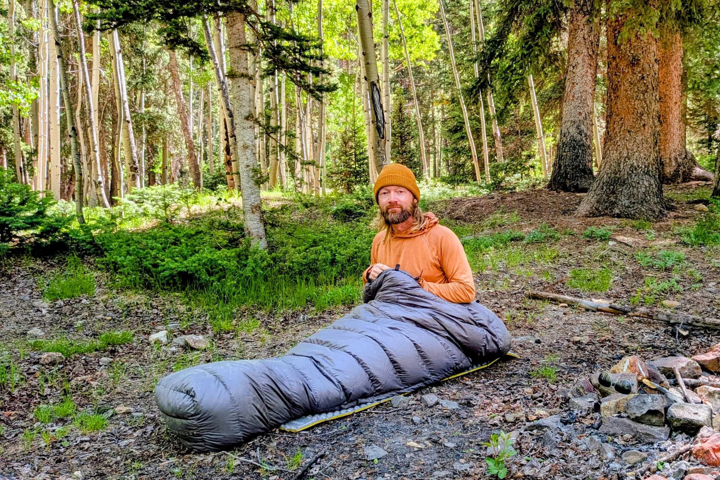 Outdoor Vitals StormLoft 15 Down TopQuilt — man sitting in the woods