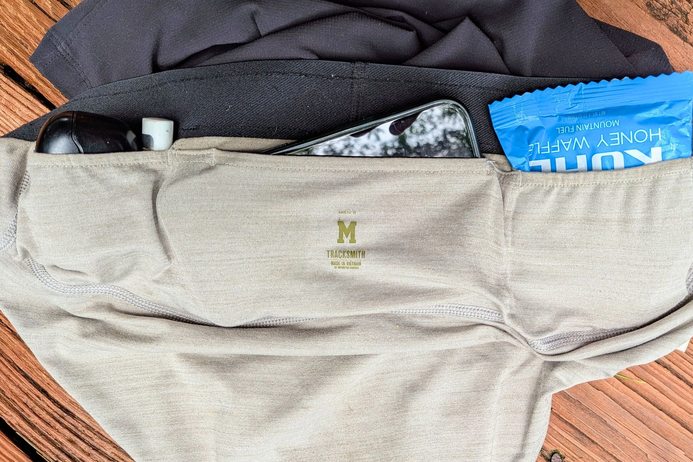 Tracksmith Twilight Running Shorts with a cell phone in the pocket.