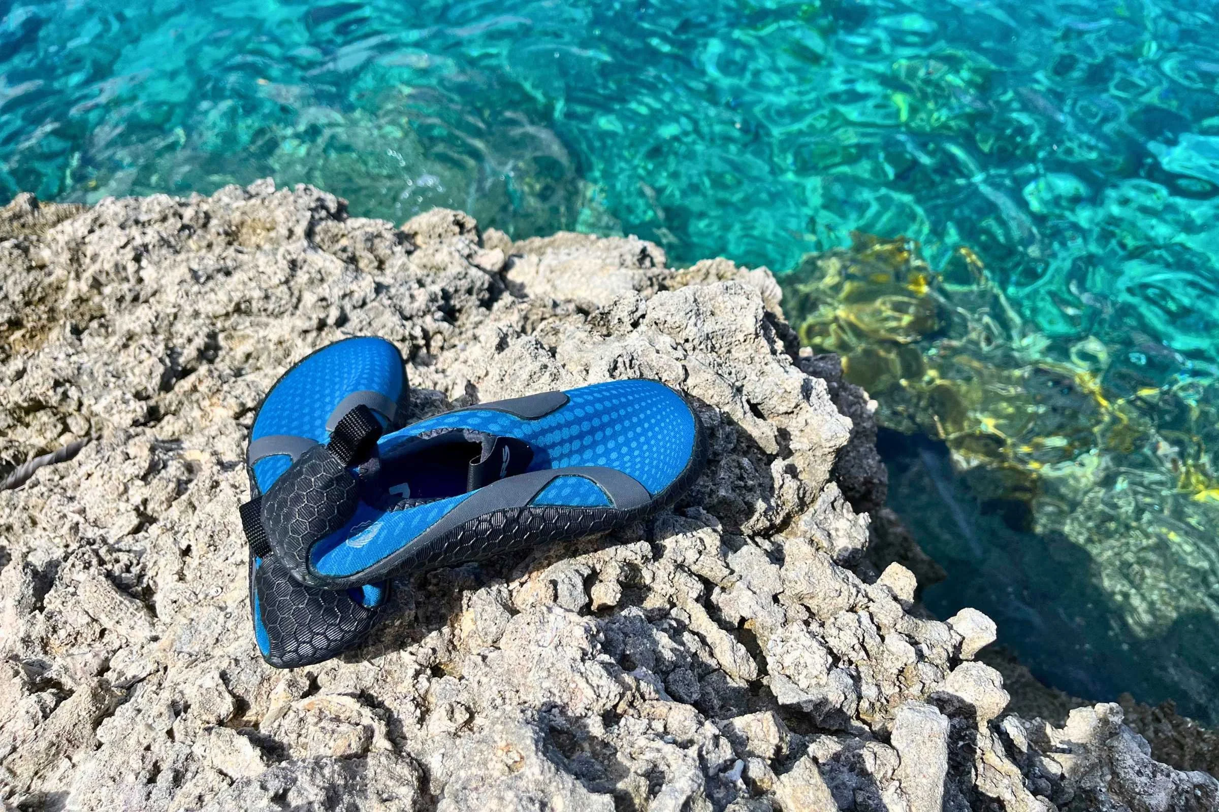 Testing water shoes on a trip to the Maldives.