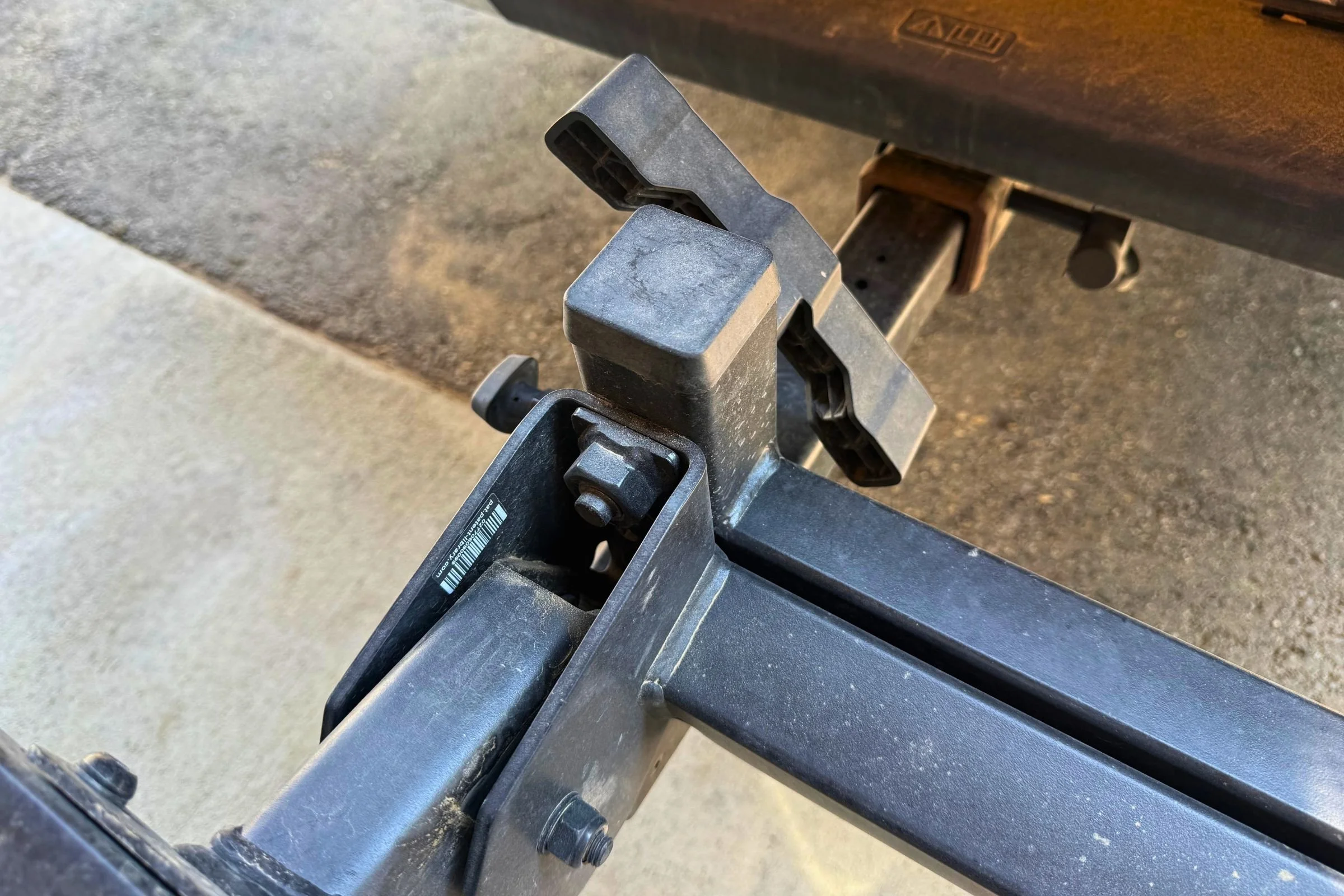 Close-up of the anti-wobble hitch connection on the Yakima StepUp Swing 2” Hitch Bike Rack.