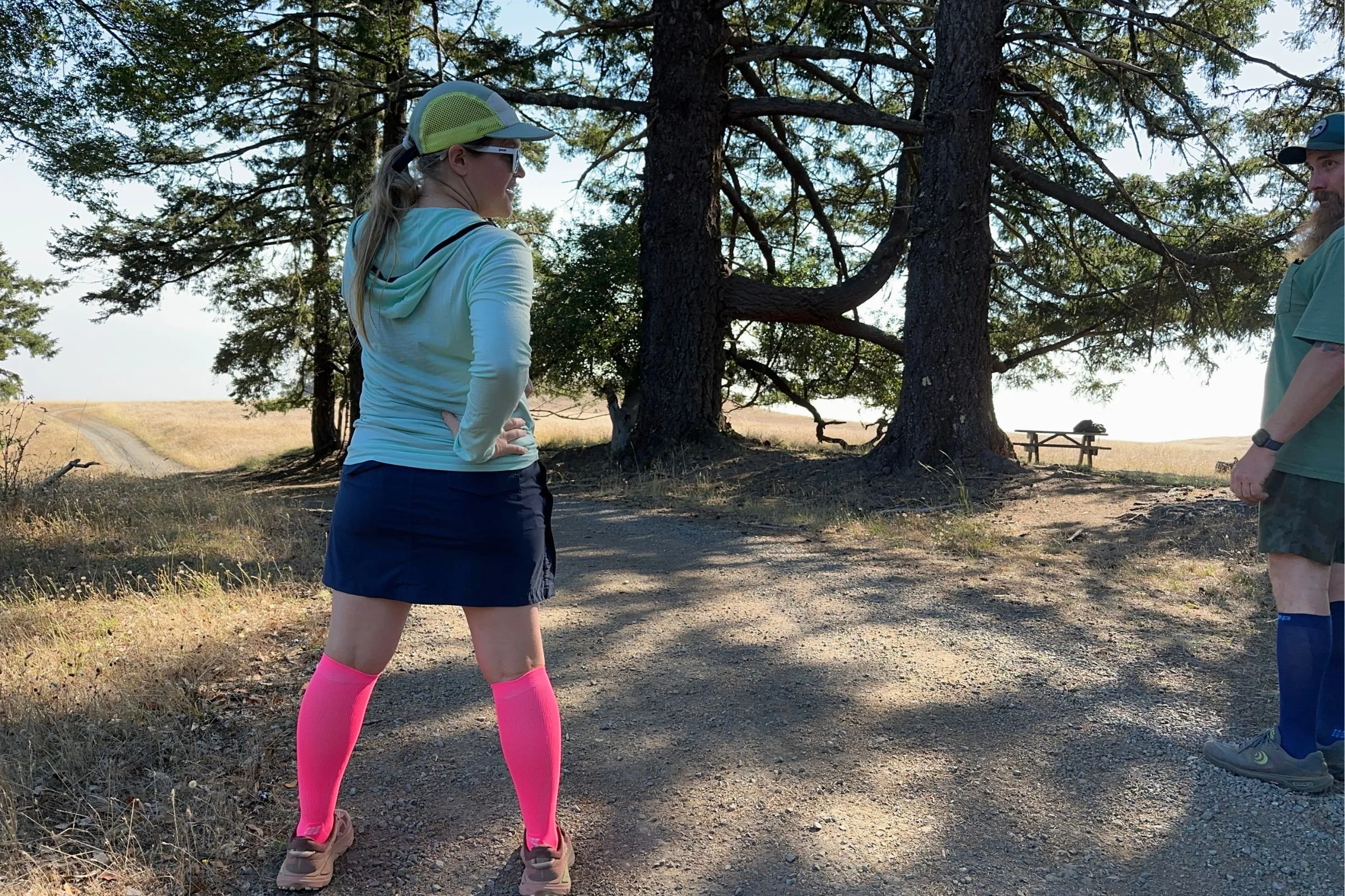 Tester our on a gravel road in the CEP Core Run Tall Compression Socks