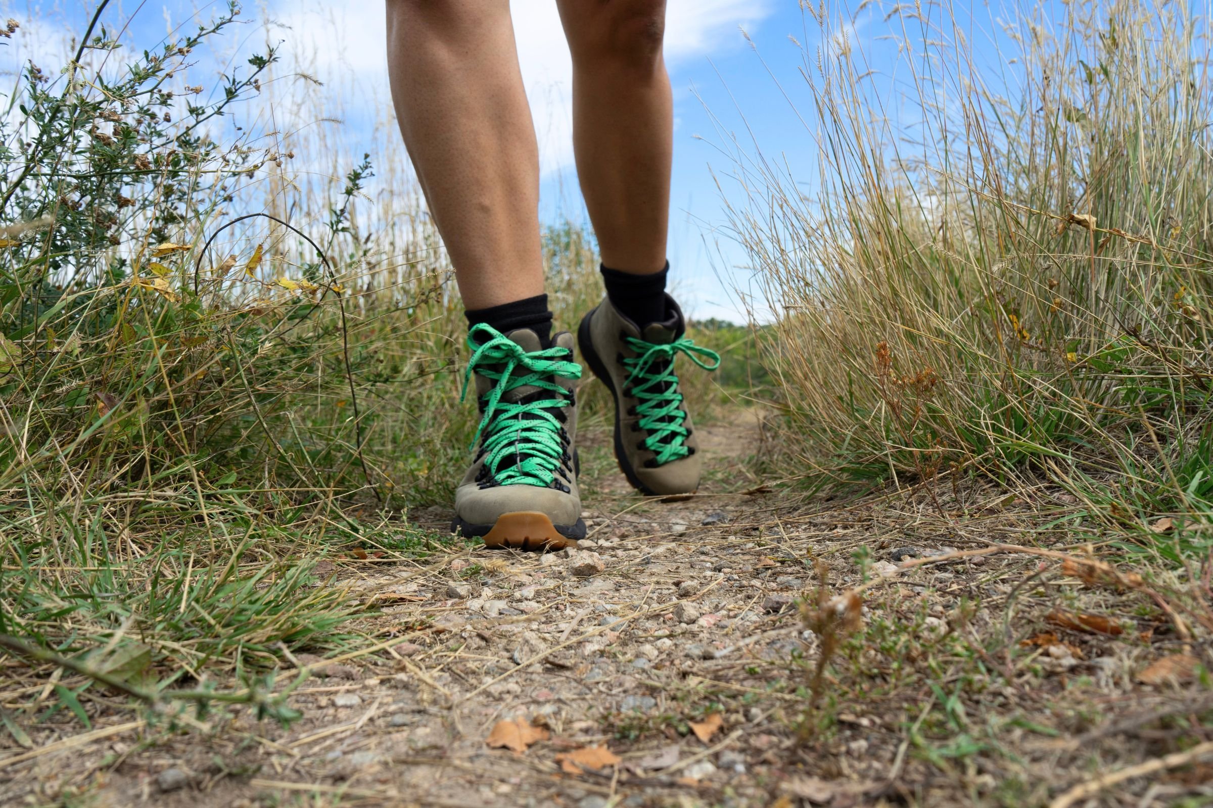 Hiking in a pair of women’s hiking boots on a gravel trail