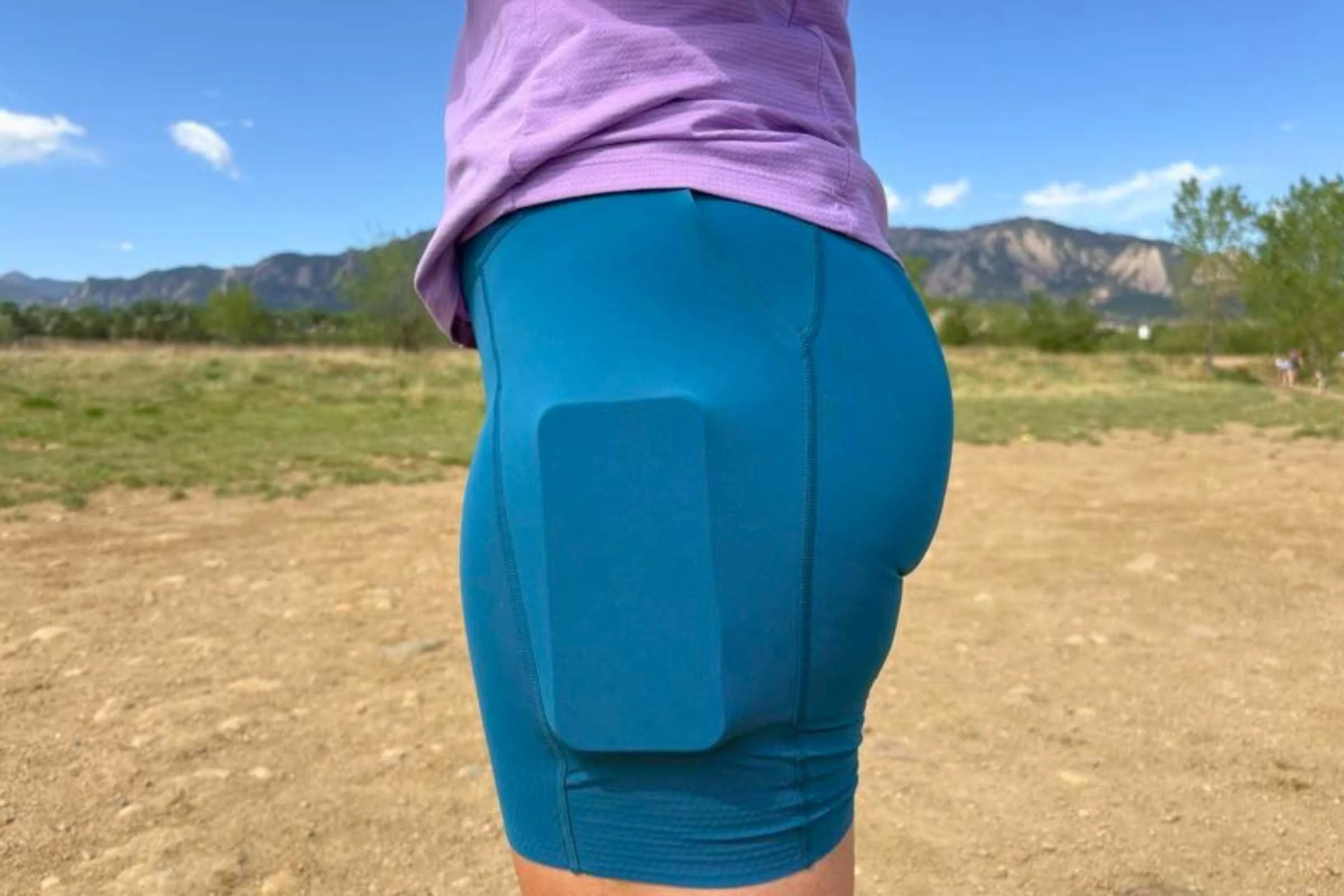 The drop-in side pockets easily fit my iPhone (with an Otterbox case and a PopSocket attached). The fabric is tight enough that nothing bounced around during runs, even speed work or when going uphill.