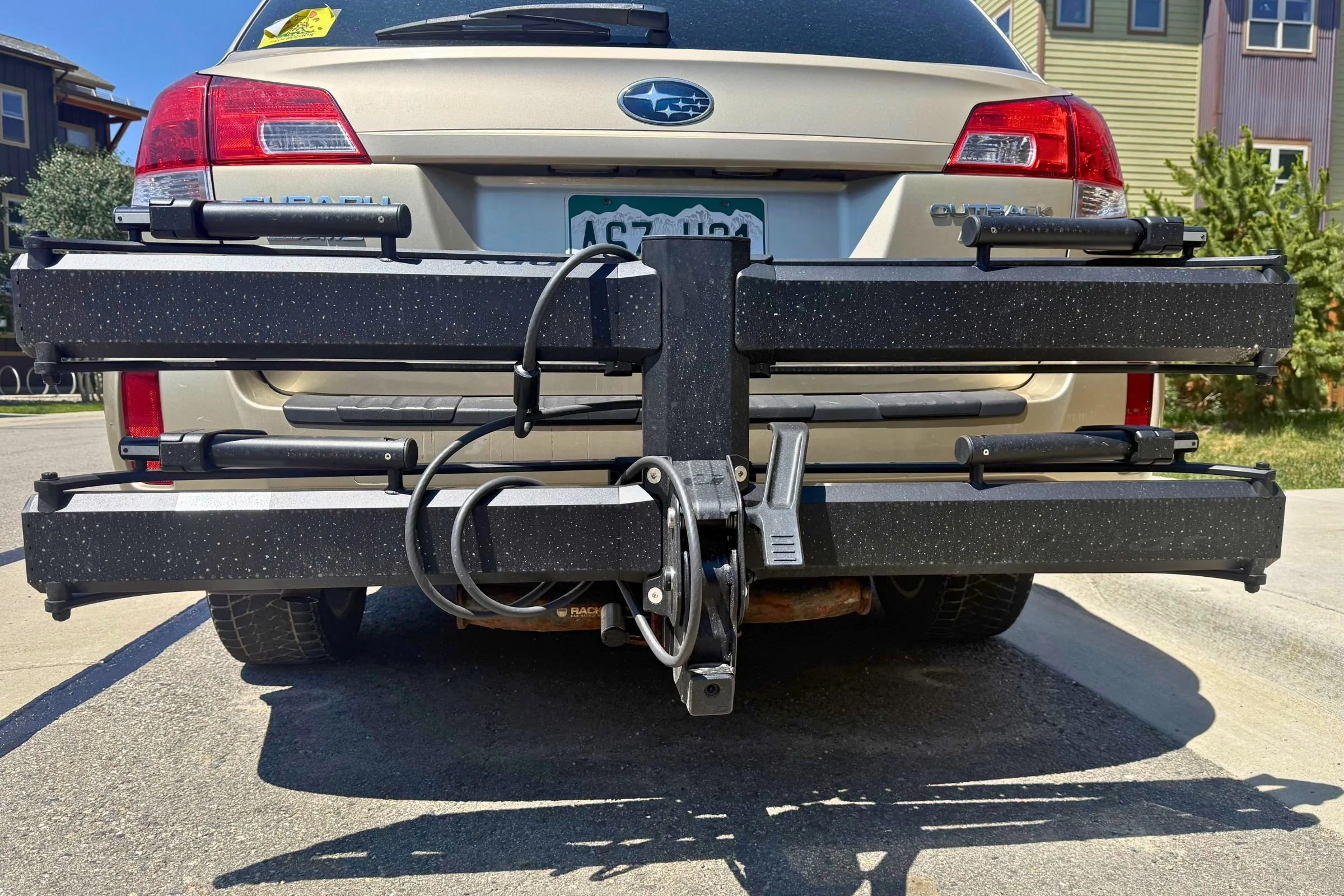 Kuat Piston Pro folded upright against the vehicle when empty