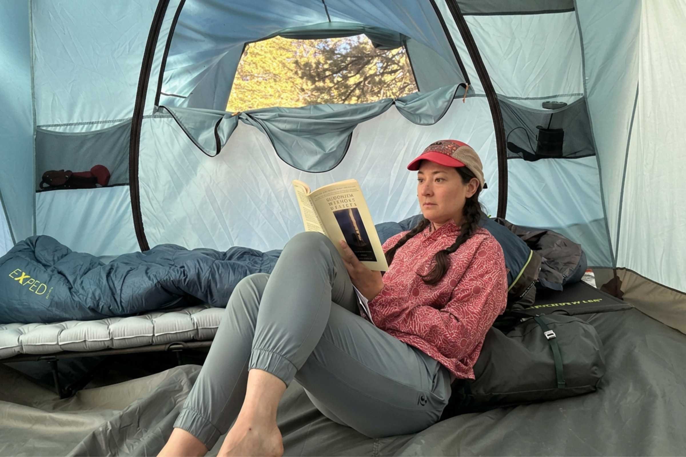 REI Co-op Westward 6 Tent interior with person reading