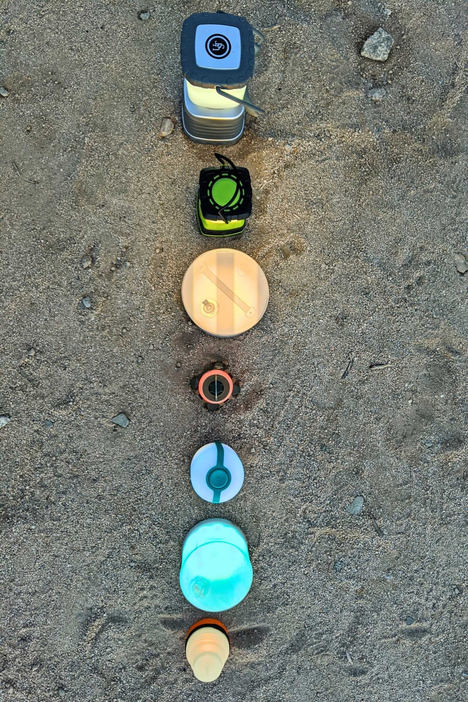 Camping lanterns comparison in campsite shot from above