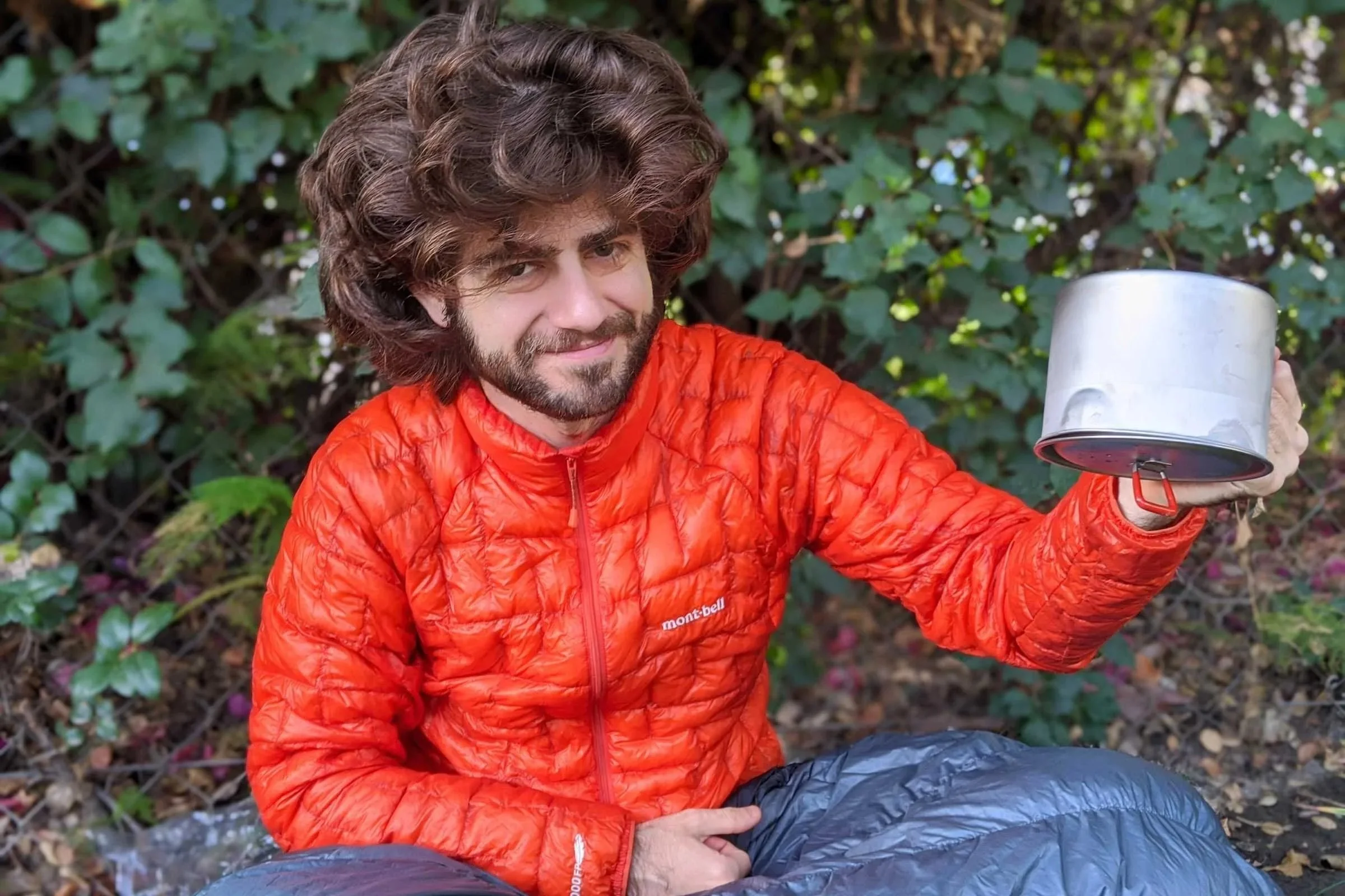 Person holding the MSR Titan backpacking cook pot upside down