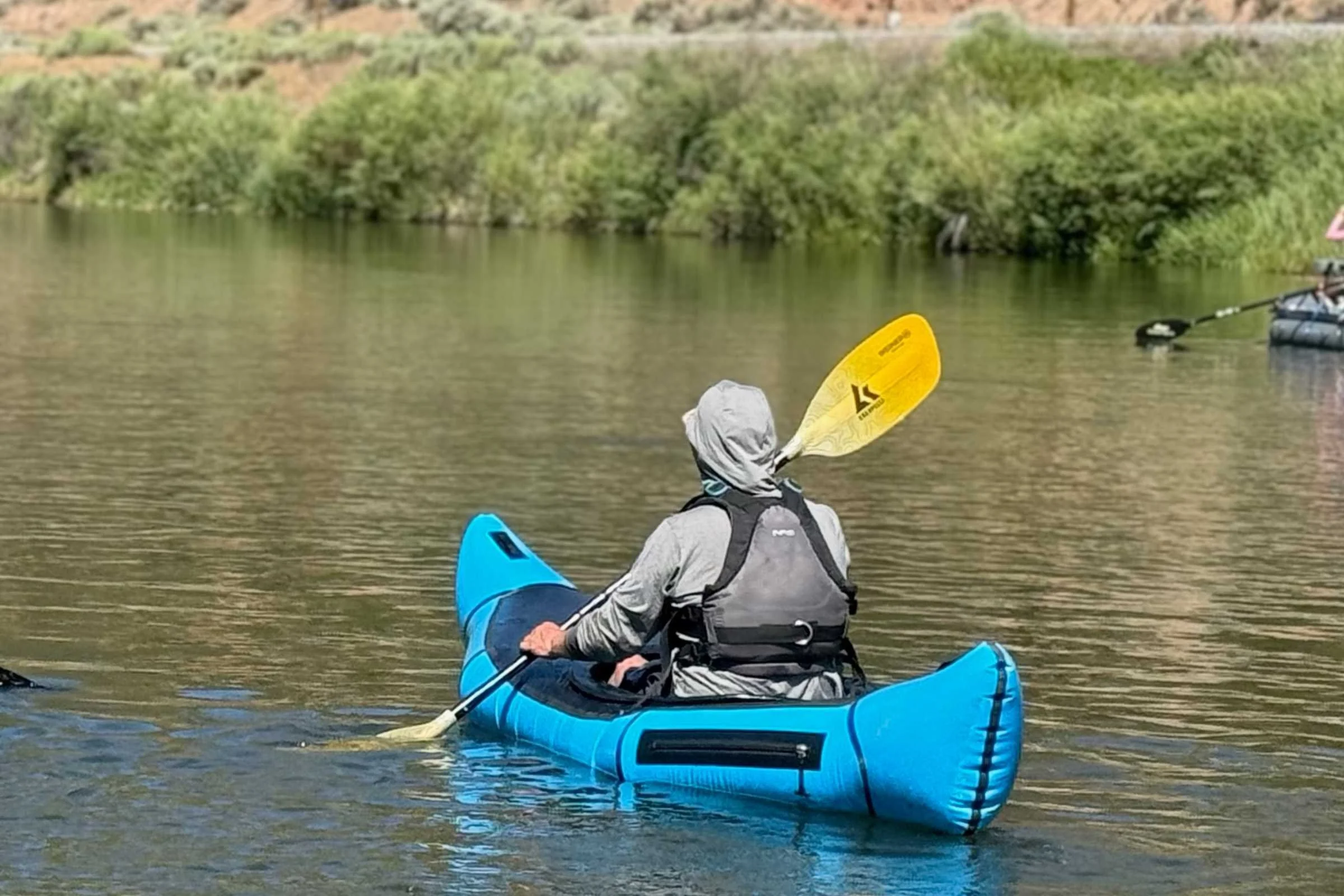 The Alpacka Chinook’s cargo fly on the rear left side still allows paddlers to stow gear on both sides of the hull.