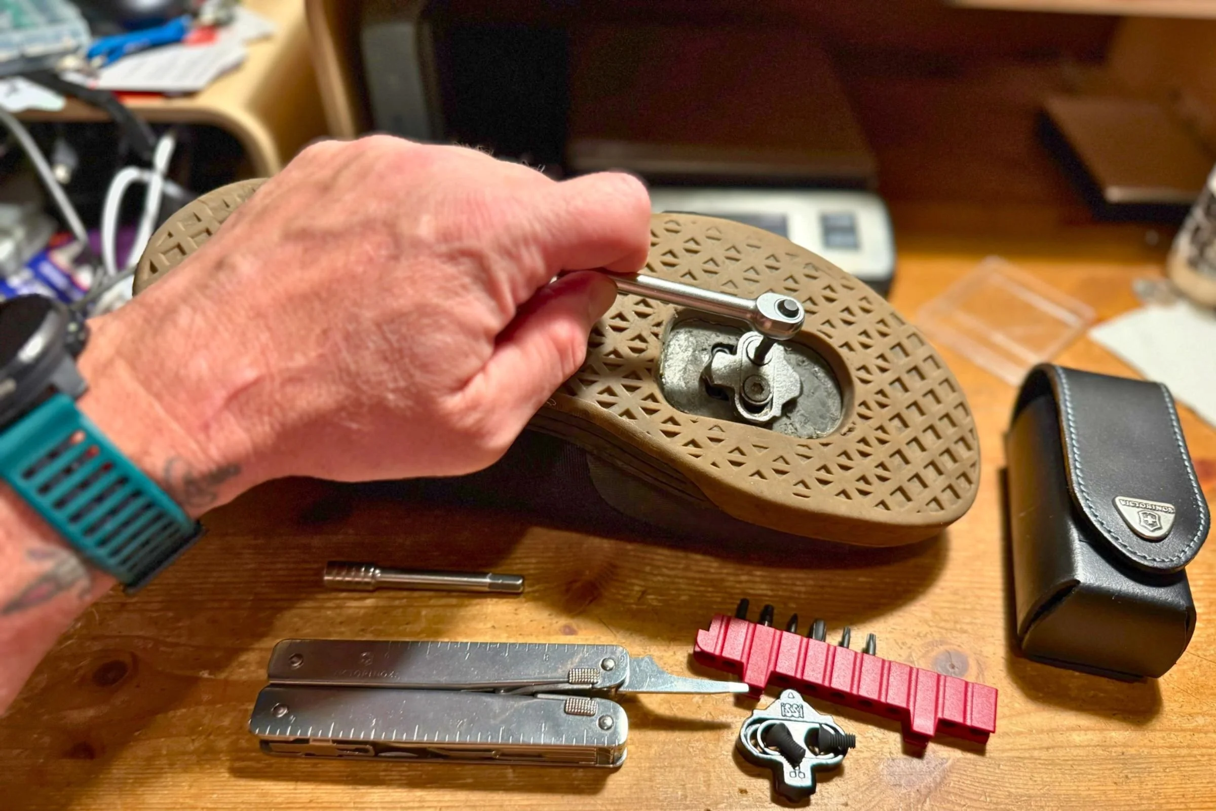 The Victorinox Swiss Tool X Plus Ratchet and all of its components. Using the ratchet to tighten cleats on a gravel shoe. Courtesy Chris Meehan