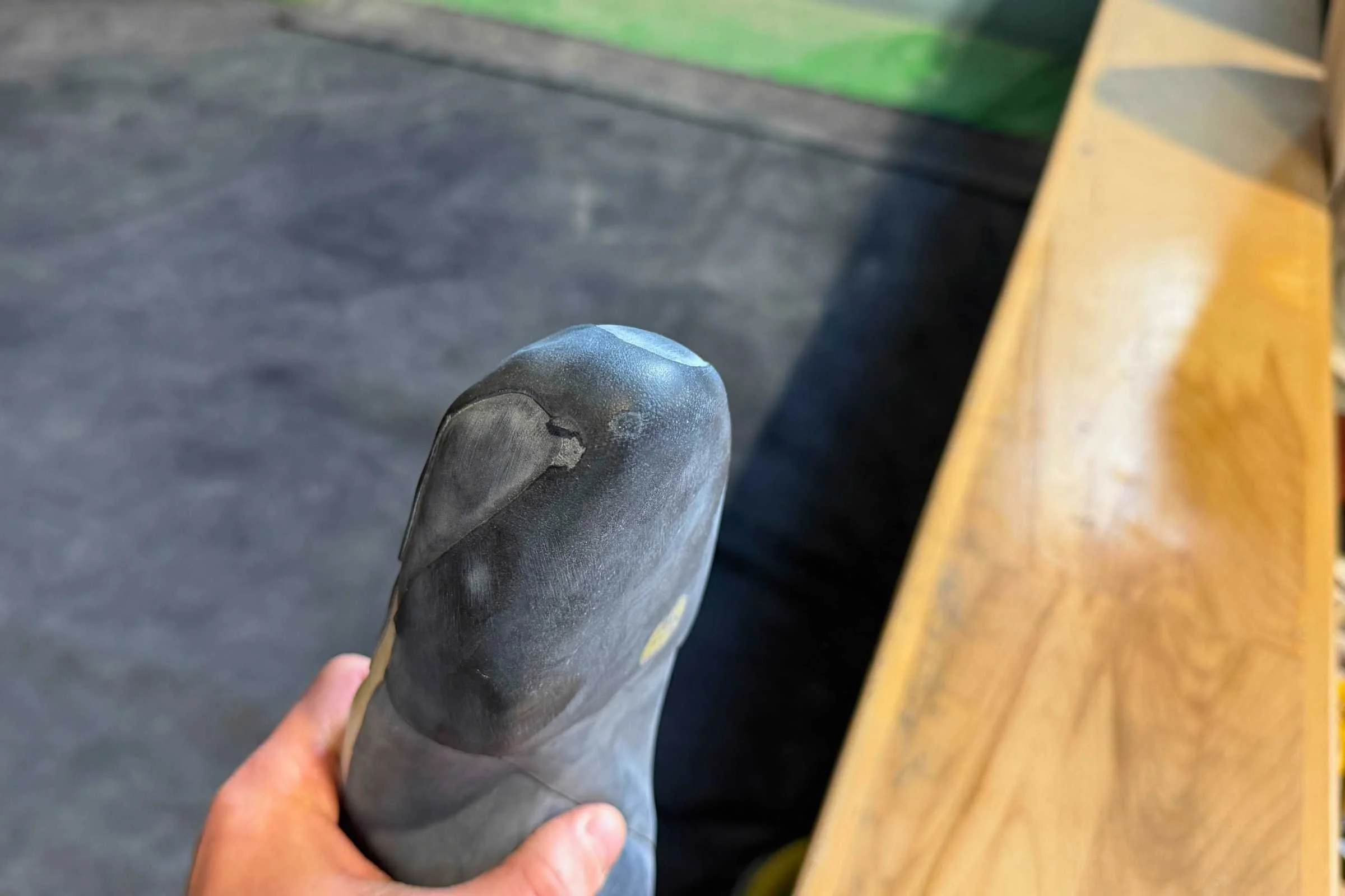 The extra rubber coverage means more durability for the tip of the toe. Ours are nearly two years old and just now ready for a resole.