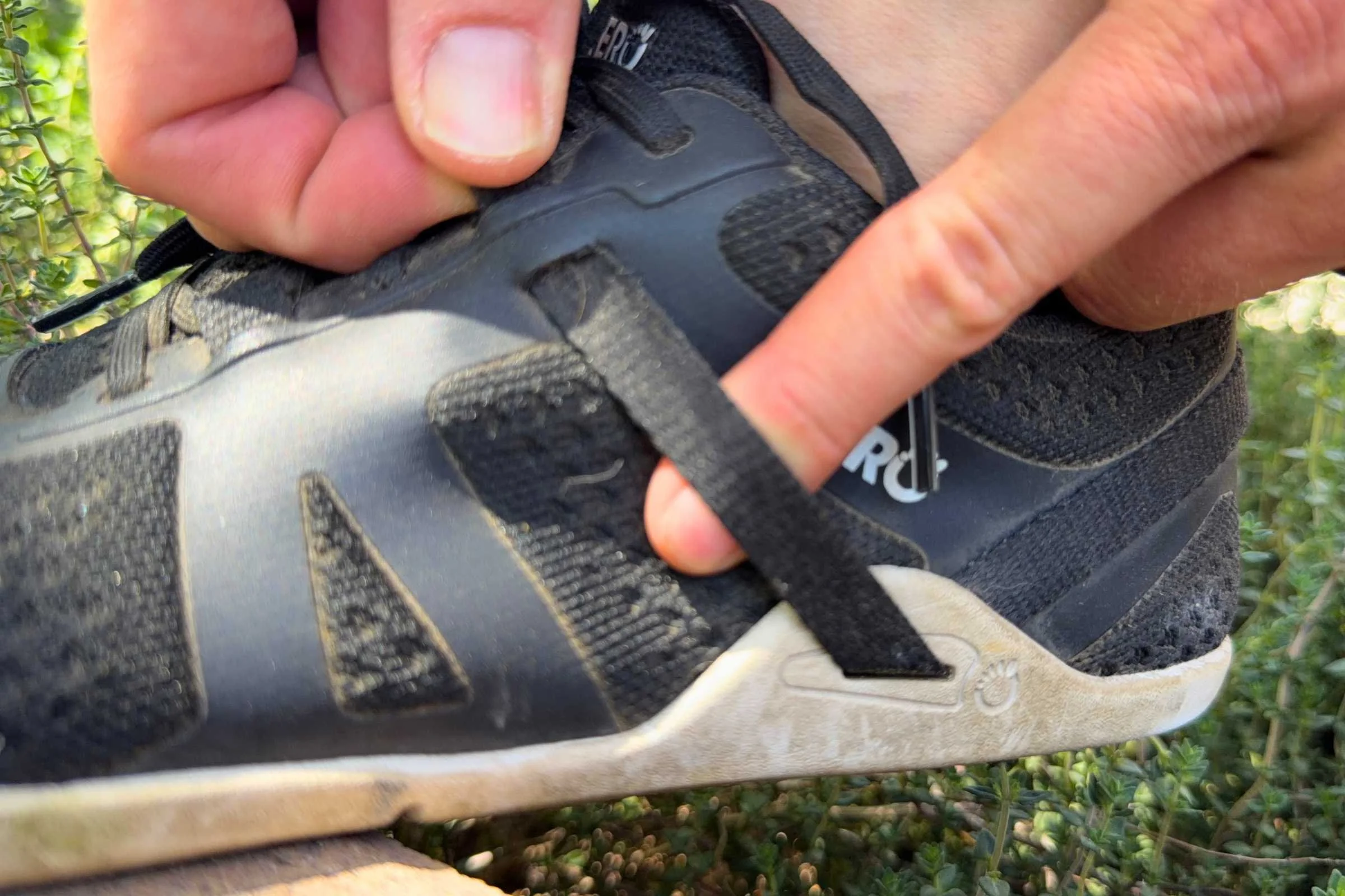 Showing the single adjustment strap of the Xero Prio Neo that attaches to the laces, allowing you to customize the instep and heel fit of the shoe. Photo courtesy Maggie Nichols