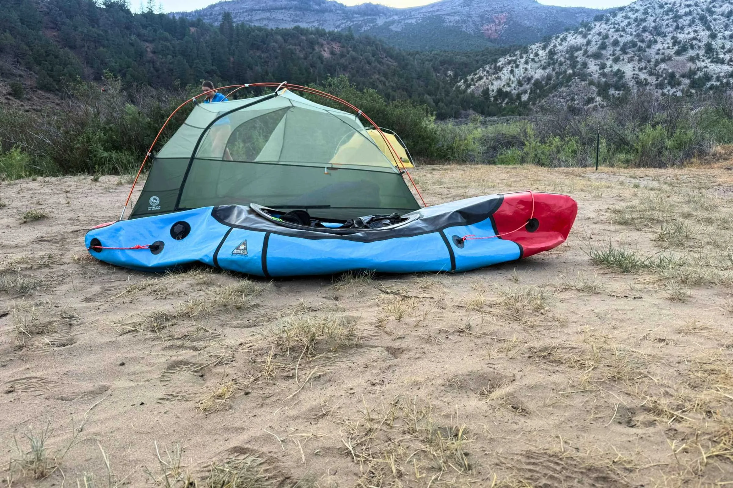 The deflated Mage next to a Big Agnes 2 person Copper Spur Hyperbead tent.