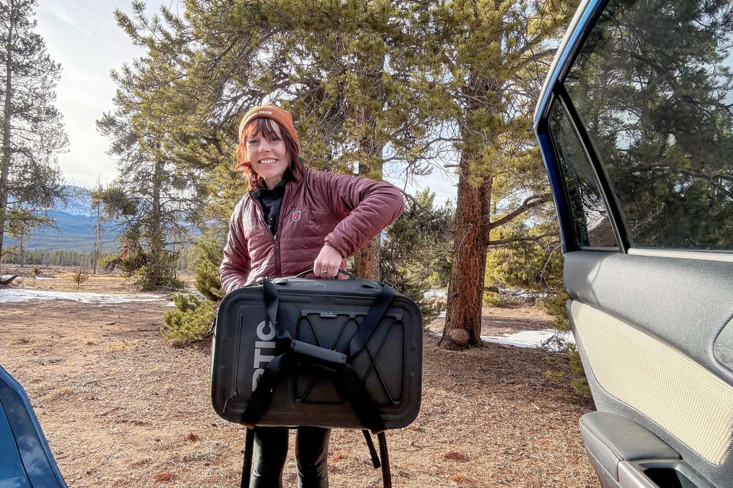 Hoisting the RTIC Ultra Dry Duffle Pack by the sturdy side handle
