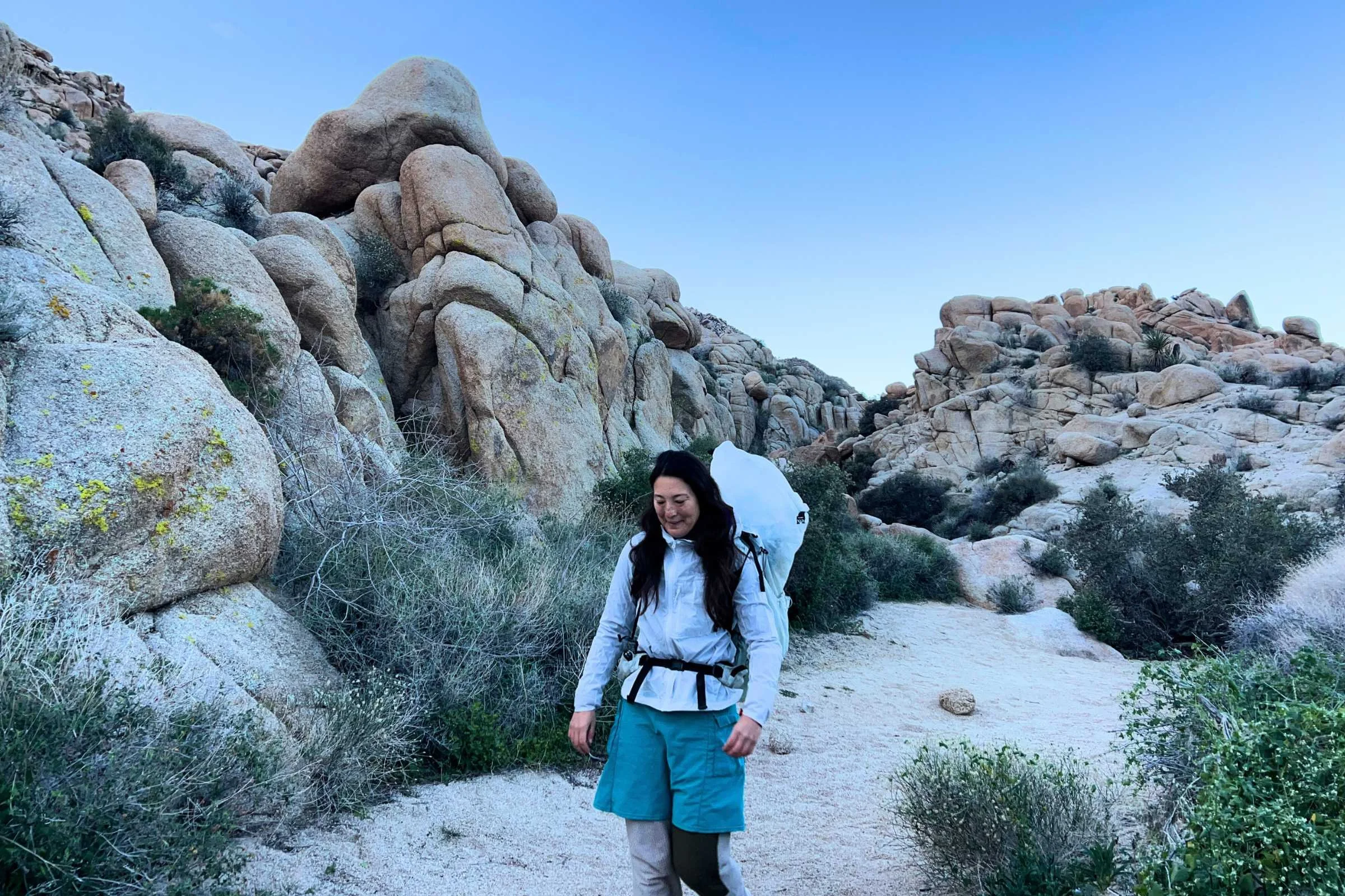 the author backpacking with the mountain hardwear alakazam with rock structures in the background