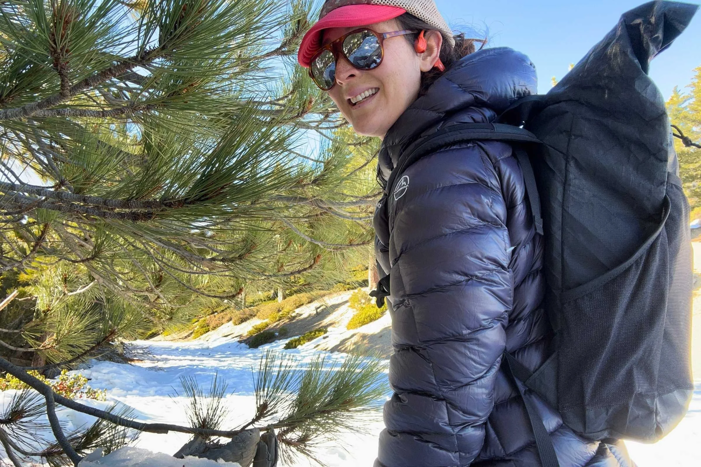 author wearing the ula ultra node 20l backpack on a snowy hike