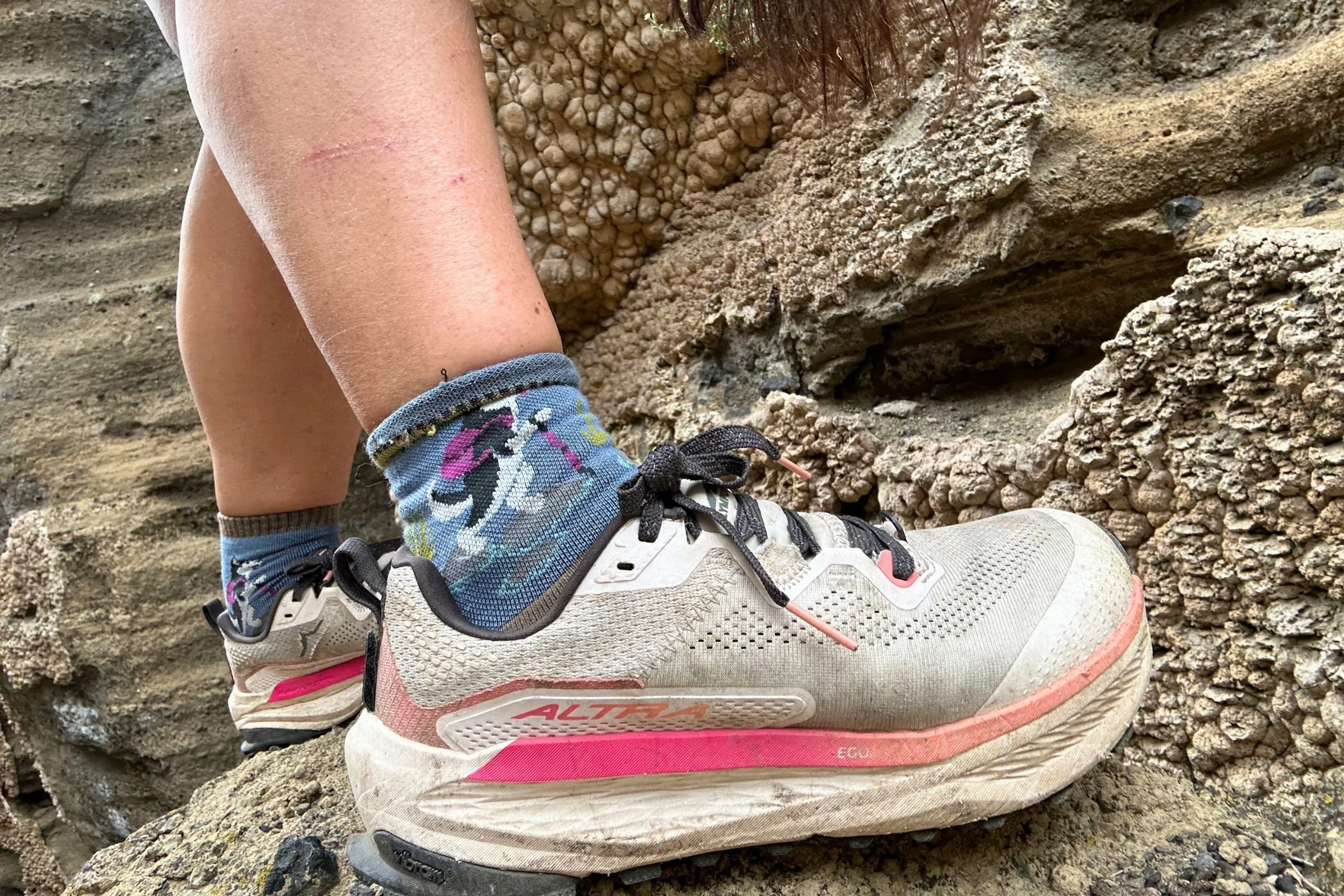 Close-up shot of white Altra Olympus 7 shoes.