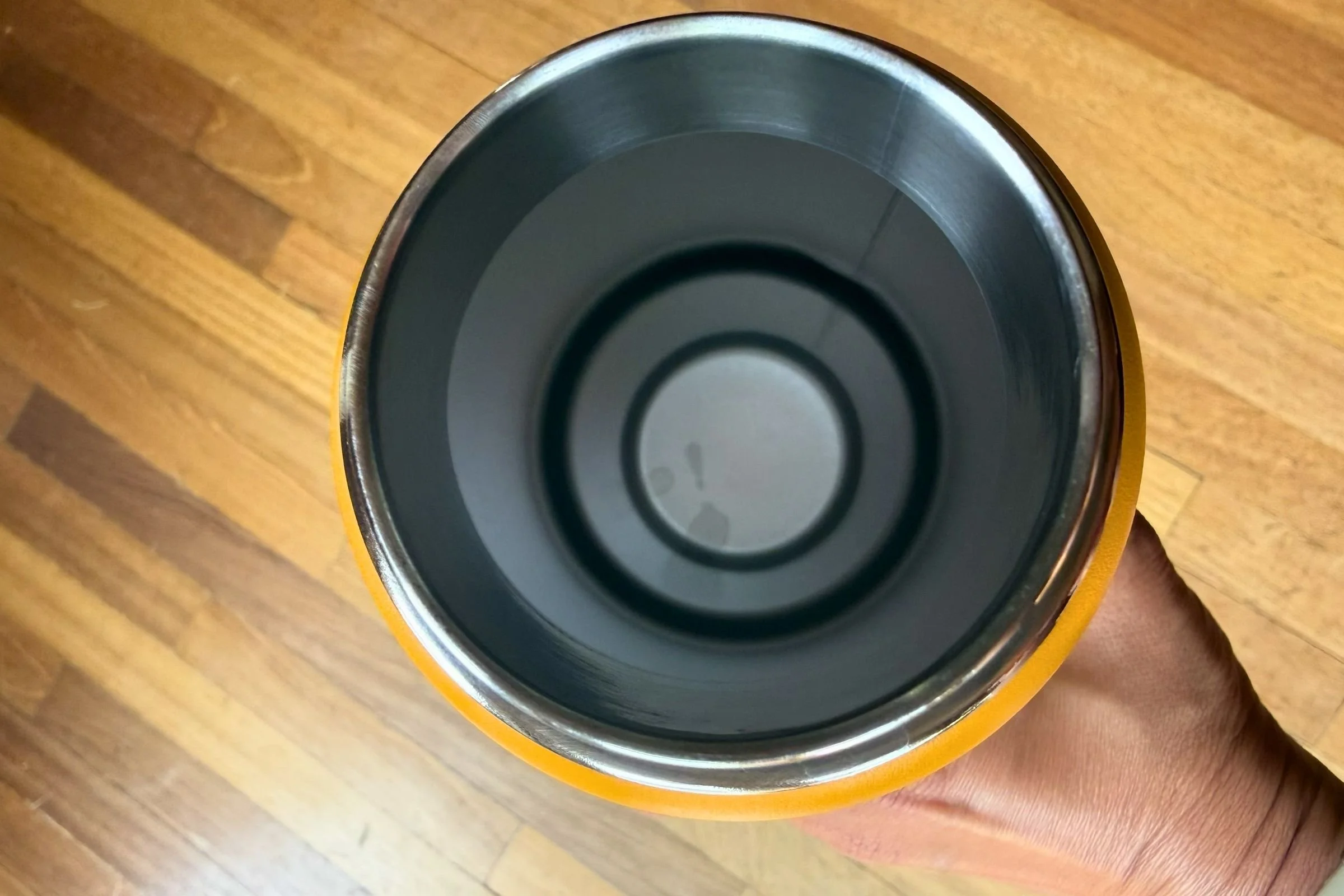 Hydro Flask 32 oz Travel Bottle with a straw attachment, showcasing its material and textured finish.