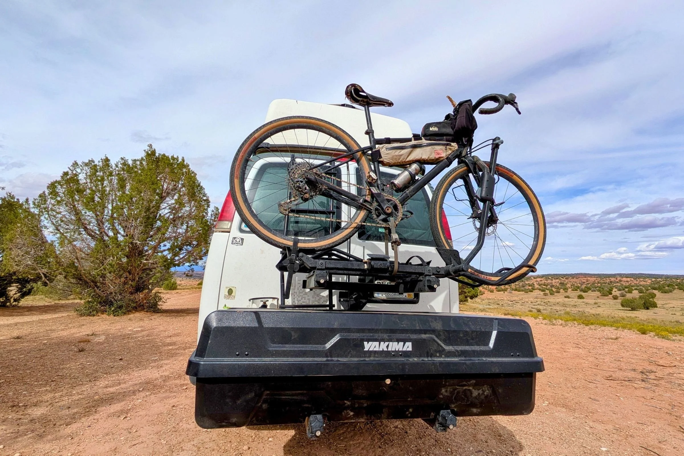 Cargo van kitted out with a Yakima EXO GearLocker hitch-mounted using the EXO SwingBase with an additional bike rack mounted on the EXO TopShelf