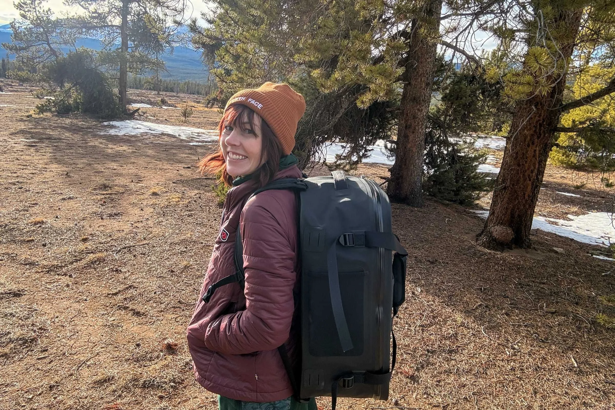 The author wearing a puffy jacket over the Youer Treasure Dress on a winter camping trip.