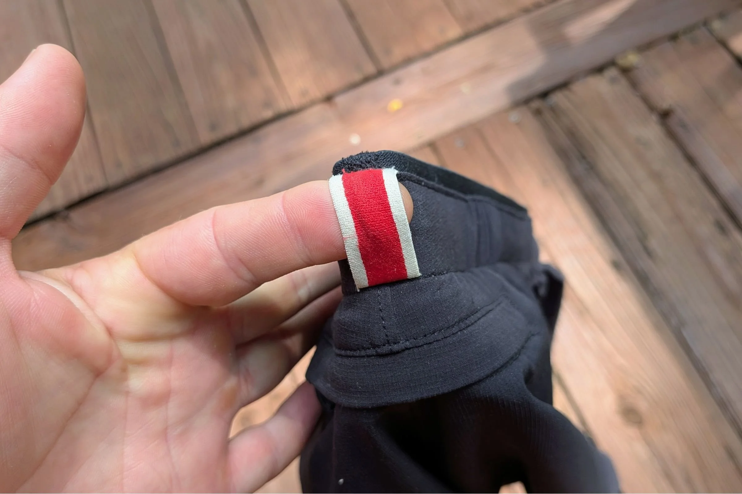 A closeup of the loop on the Tracksmith Twilight running shorts
