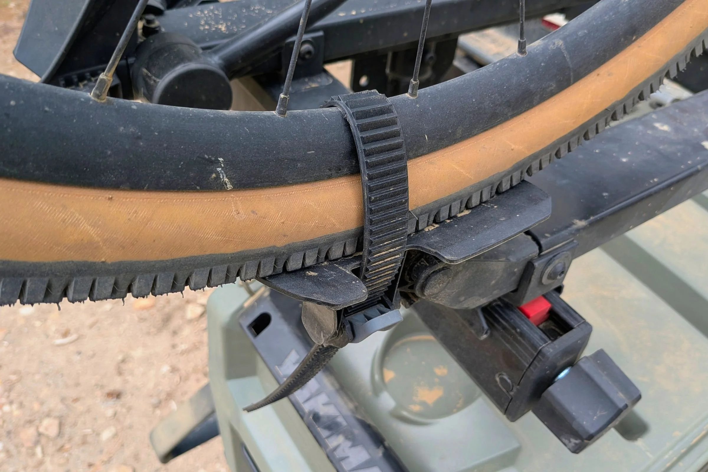 Close-up view of a bicycle secured to a Yakima EXO DoubleUp 2-Bike Hitch Rack.