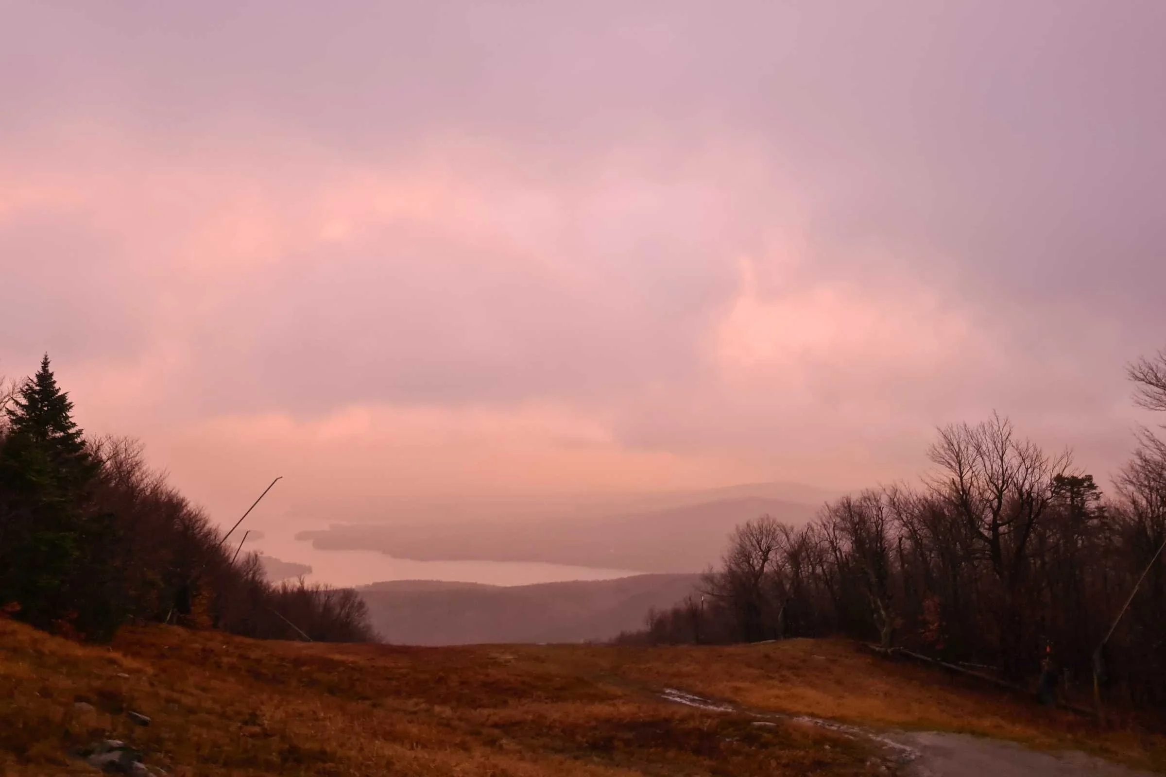 Sunrise view of Lake Sunapee from Mt Sunapee during a tropical storm. Photo by Aubri Drake.