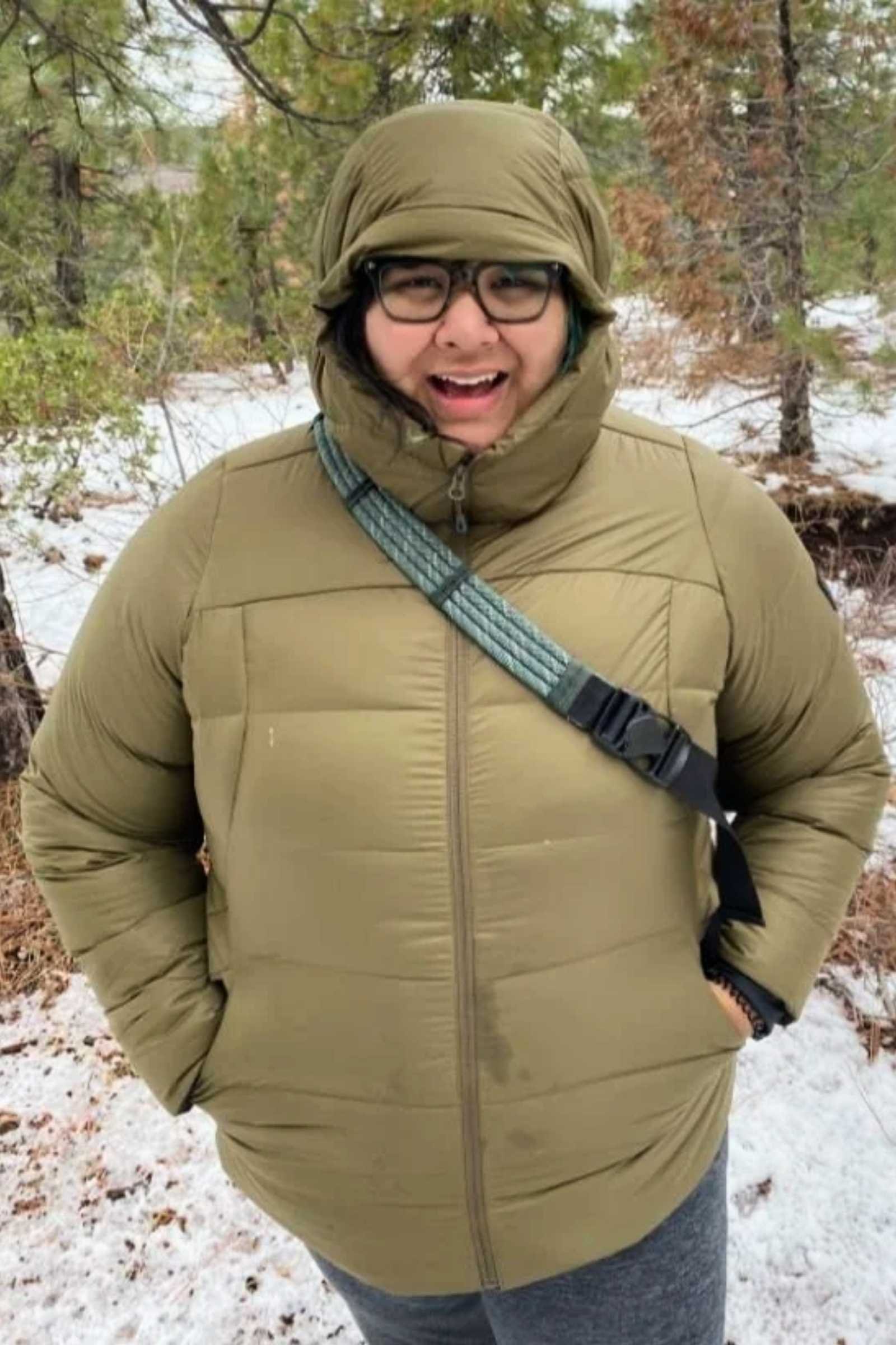 Treeline Review writer Gabi Reyes-Acosta testing the Coldfront jacket in the snow in winter in Idaho.