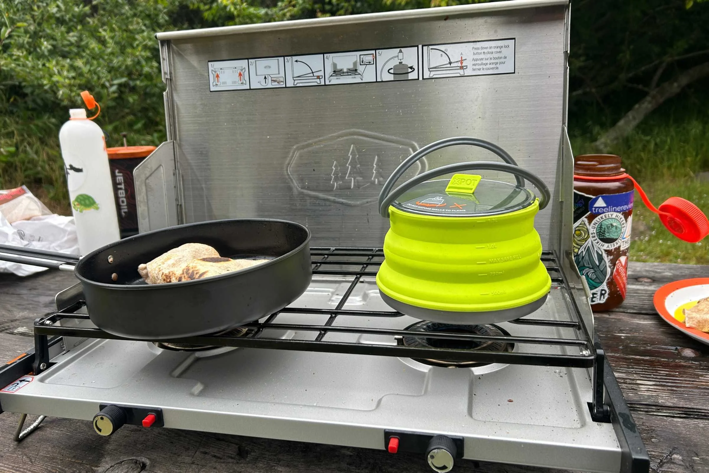 Making a burrito while boiling water on the GSI Pinnacle Pro 2 at a campsite in Bodega Bay, California.