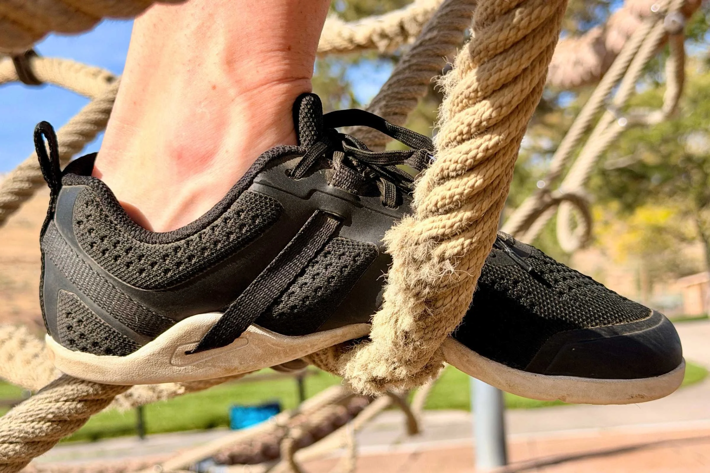 The Xero Prio Neo is one of the only shoes we’ve seen that also flexes downward; seen here standing on a thick rope. Photo courtesy Maggie Nichols