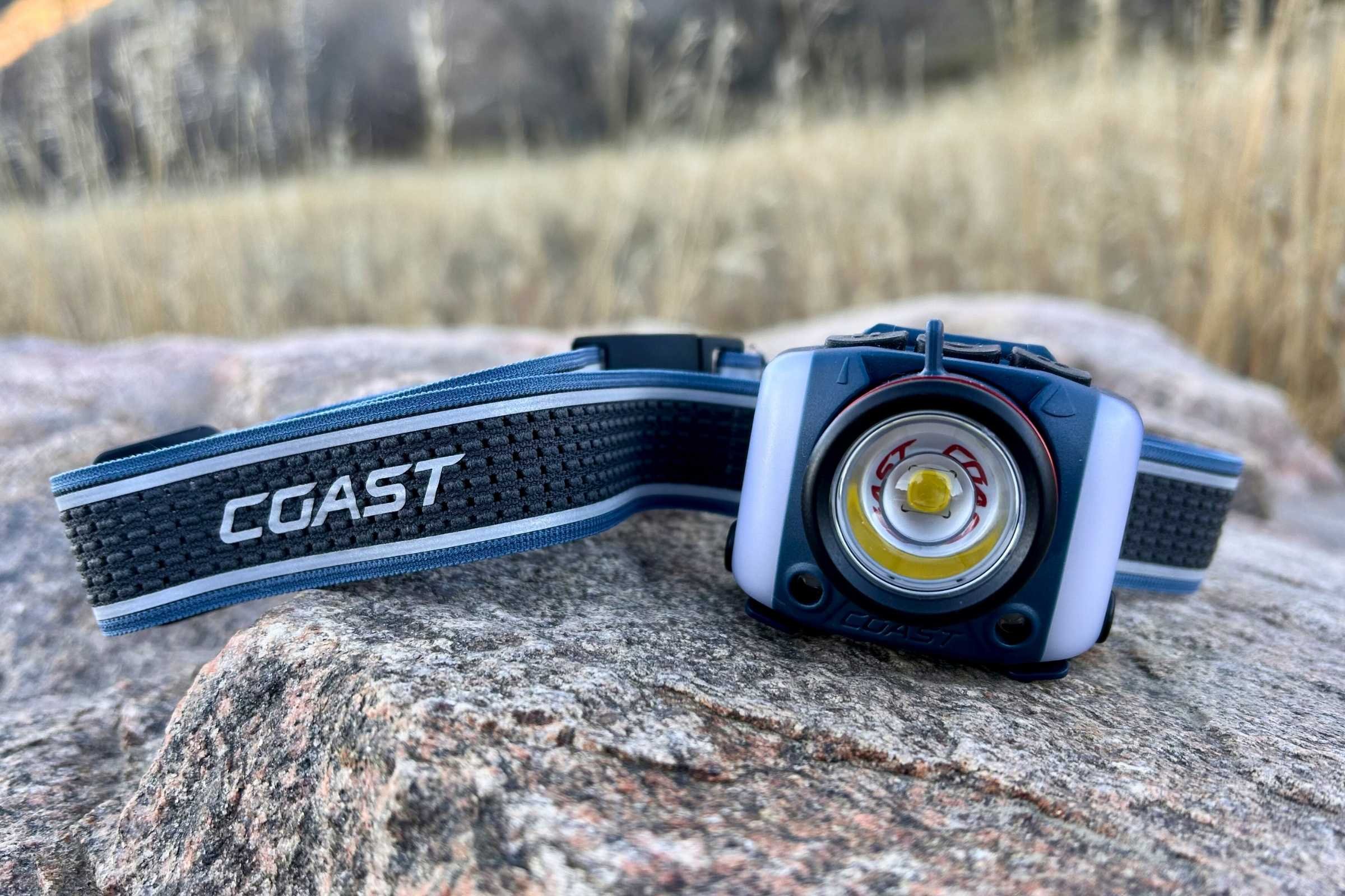 close-up of the COAST FL97R headlamp on a rock