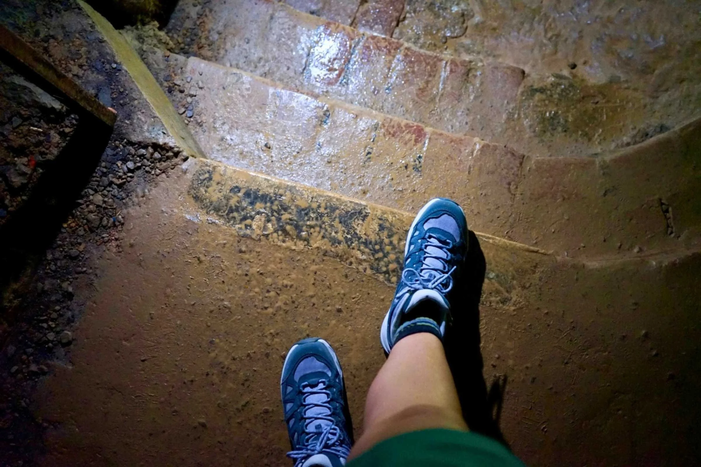 The Sawtooth Ascent Mid Waterproof Hiking boots in a wet cave.