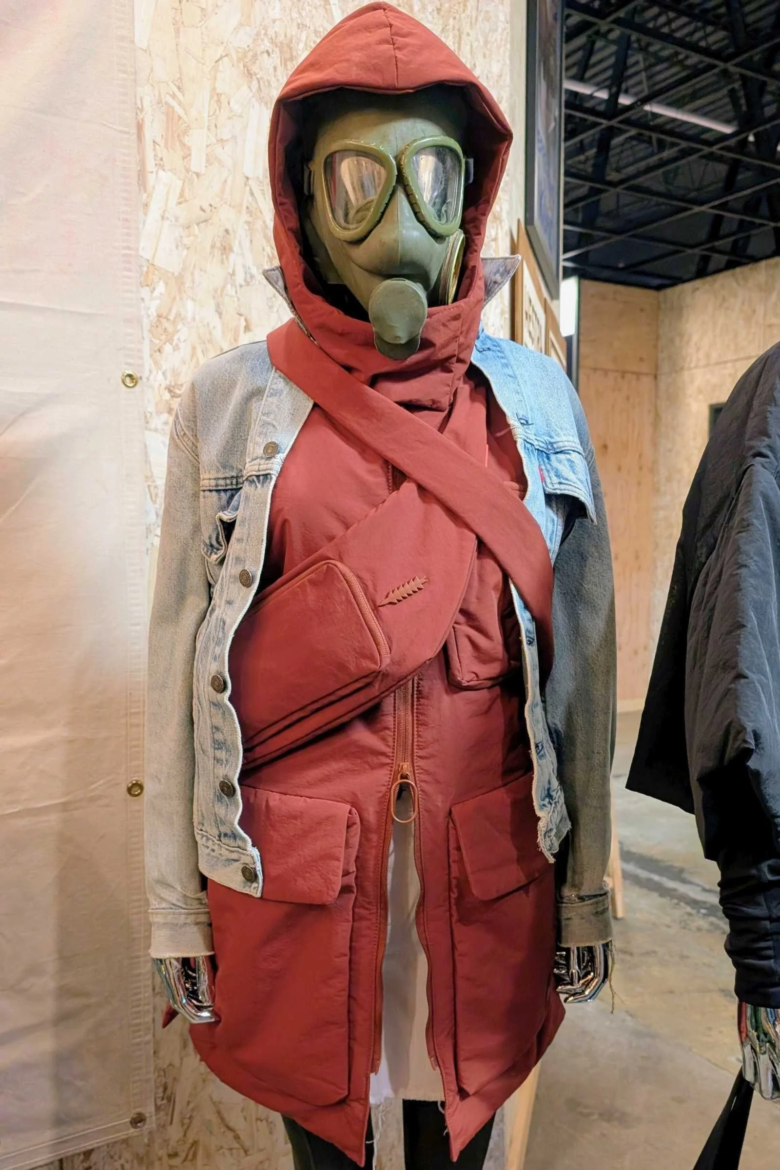 Thacker NYC mannequin display featuring gas mask and crossbody bag at Outdoor Market Alliance Winter 2026