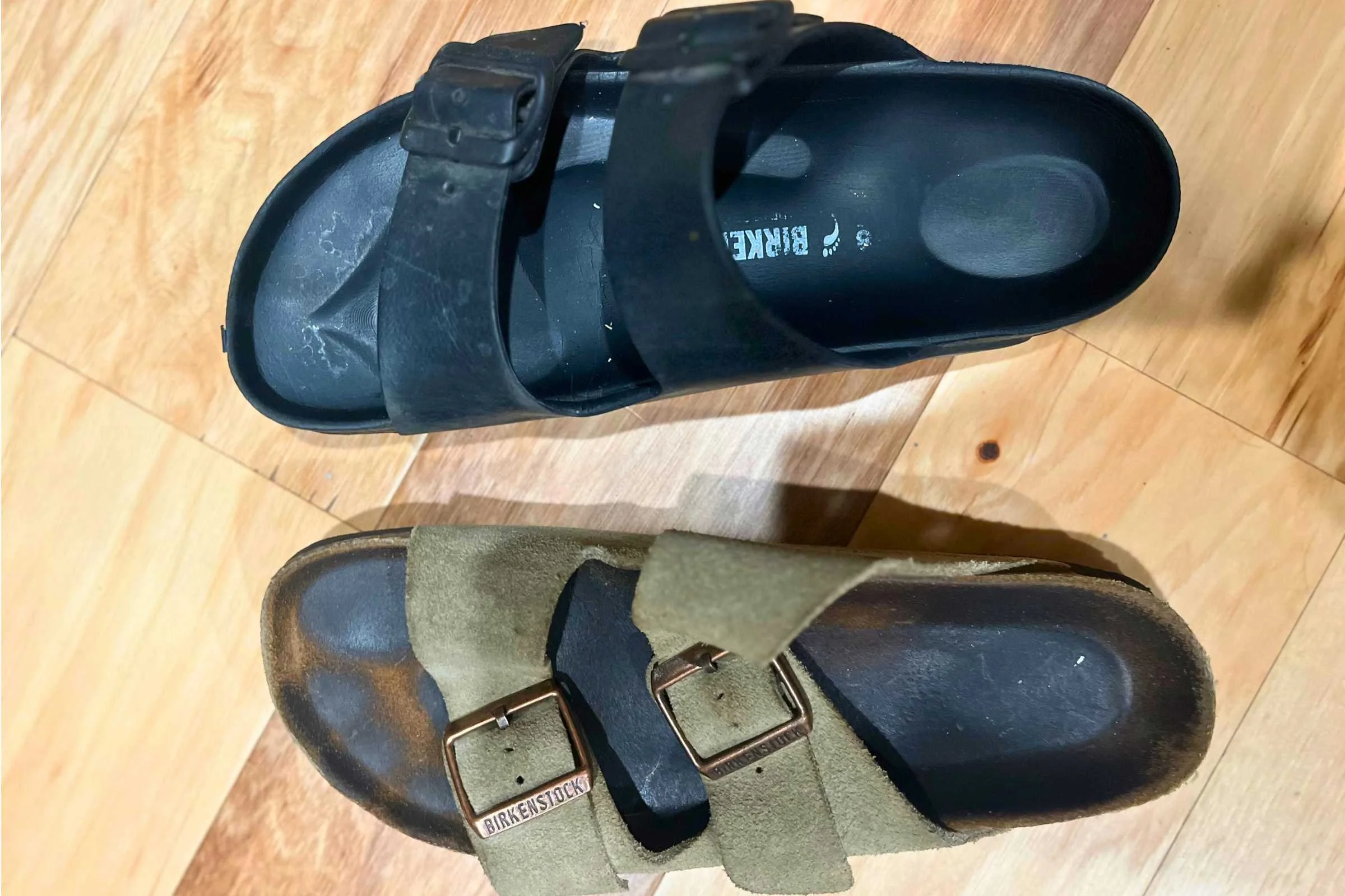 Birkenstock arizona EVA sandal in black (top) and and Birkenstock Arizona soft footbed sandal (bottom)