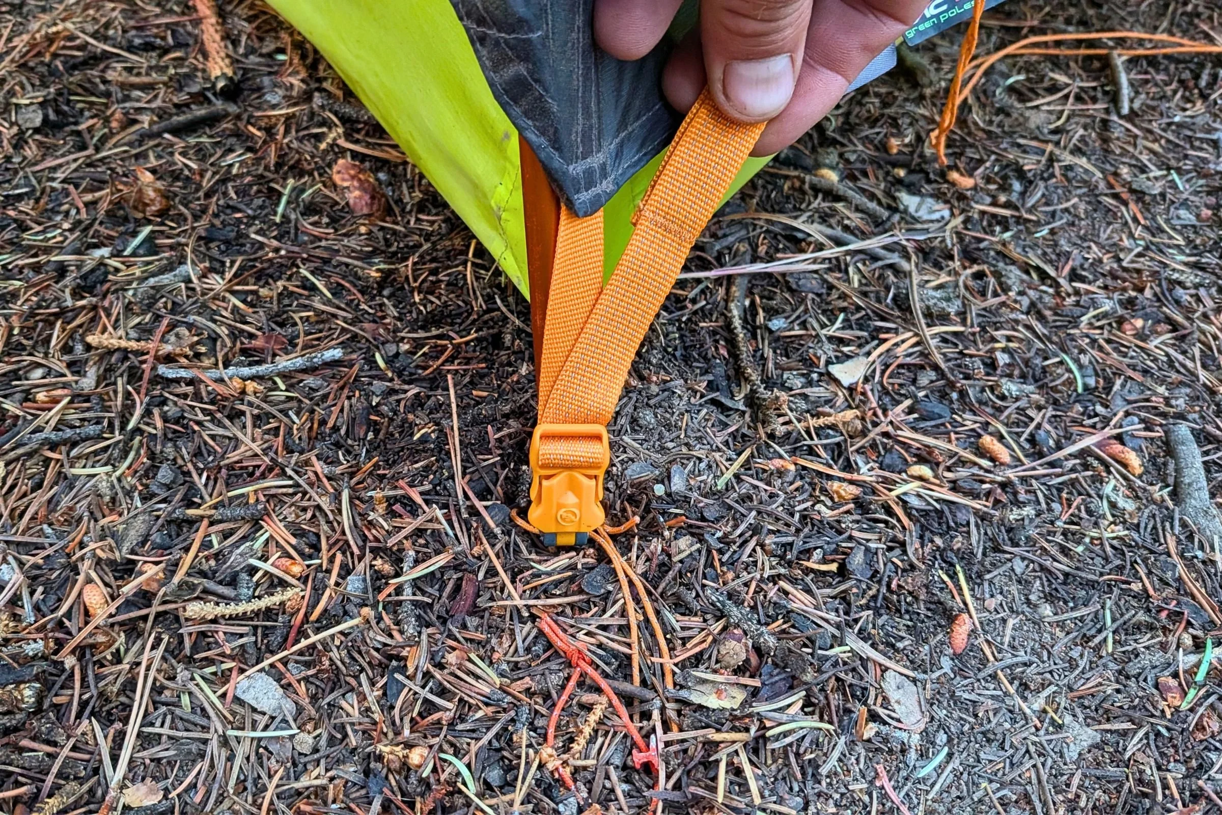 A closeup of The Big Agnes Tiger Wall UL1 Bikepack Tent's strap color coding.